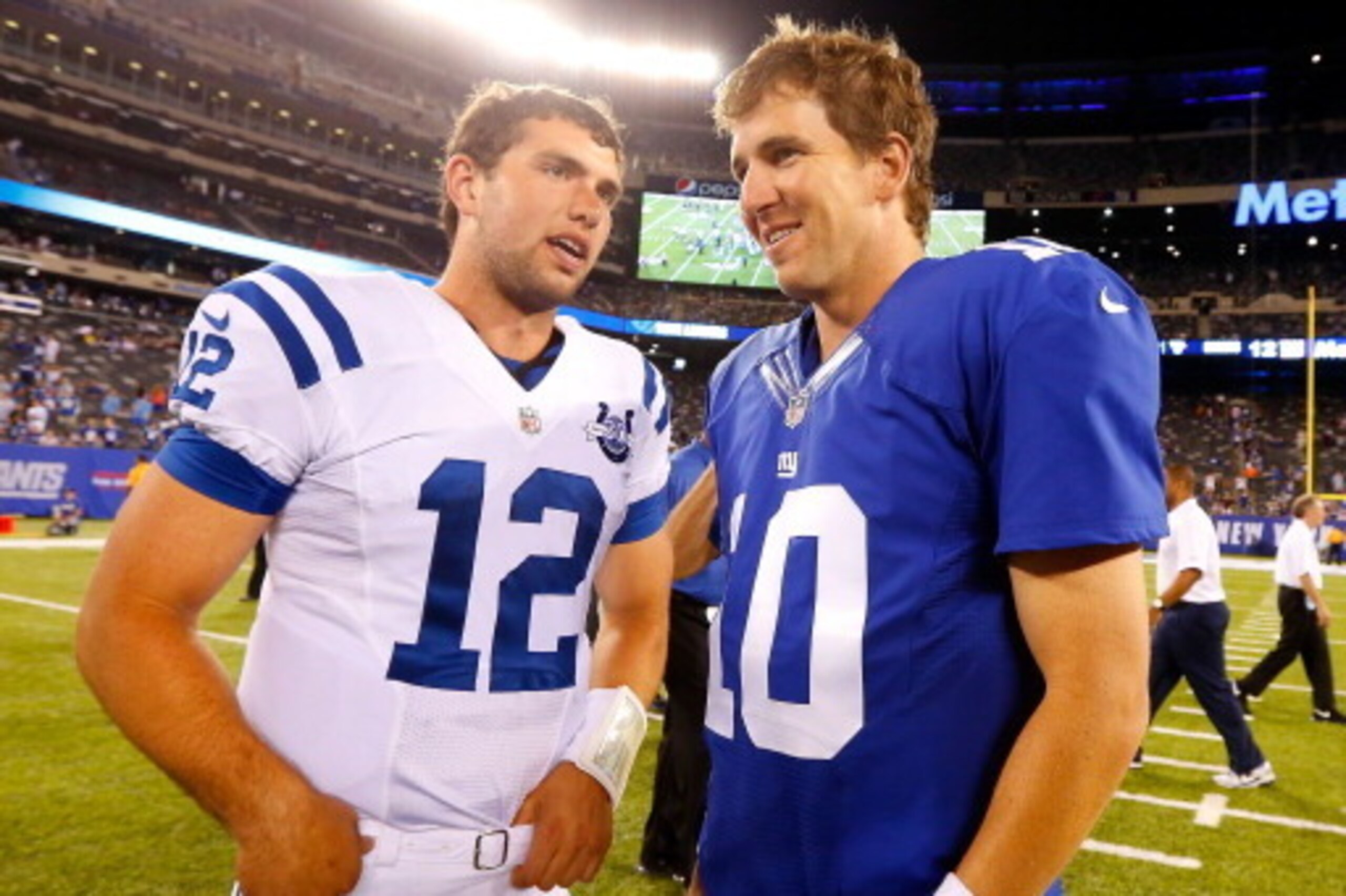 EAST RUTHERFORD, NJ - AUGUST 18:  (NEW YORK DAILIES OUT)   Eli Manning #10 of the New York Giants and Andrew Luck #12 of the Indianapolis Colts meet after their preseason game on August 18, 2013 at MetLife Stadium in East Rutherford, New Jersey. The Colts