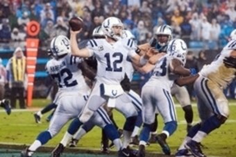 Nov 2, 2015; Charlotte, NC, USA; Indianapolis Colts quarterback Andrew Luck (12) passes the ball during the third quarter against the Carolina Panthers at Bank of America Stadium. Carolina defeated Indianapolis 29-26 in overtime. Mandatory Credit: Jeremy 