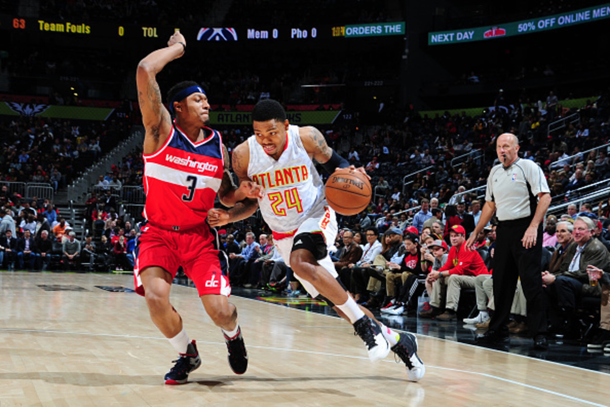 ATLANTA, GA  - MARCH 21: Kent Bazemore #24 of the Atlanta Hawks drives to the basket against Bradley Beal #3 of the Washington Wizards during the game on March 21, 2016 at Philips Arena in Atlanta, Georgia. NOTE TO USER: User expressly acknowledges and ag