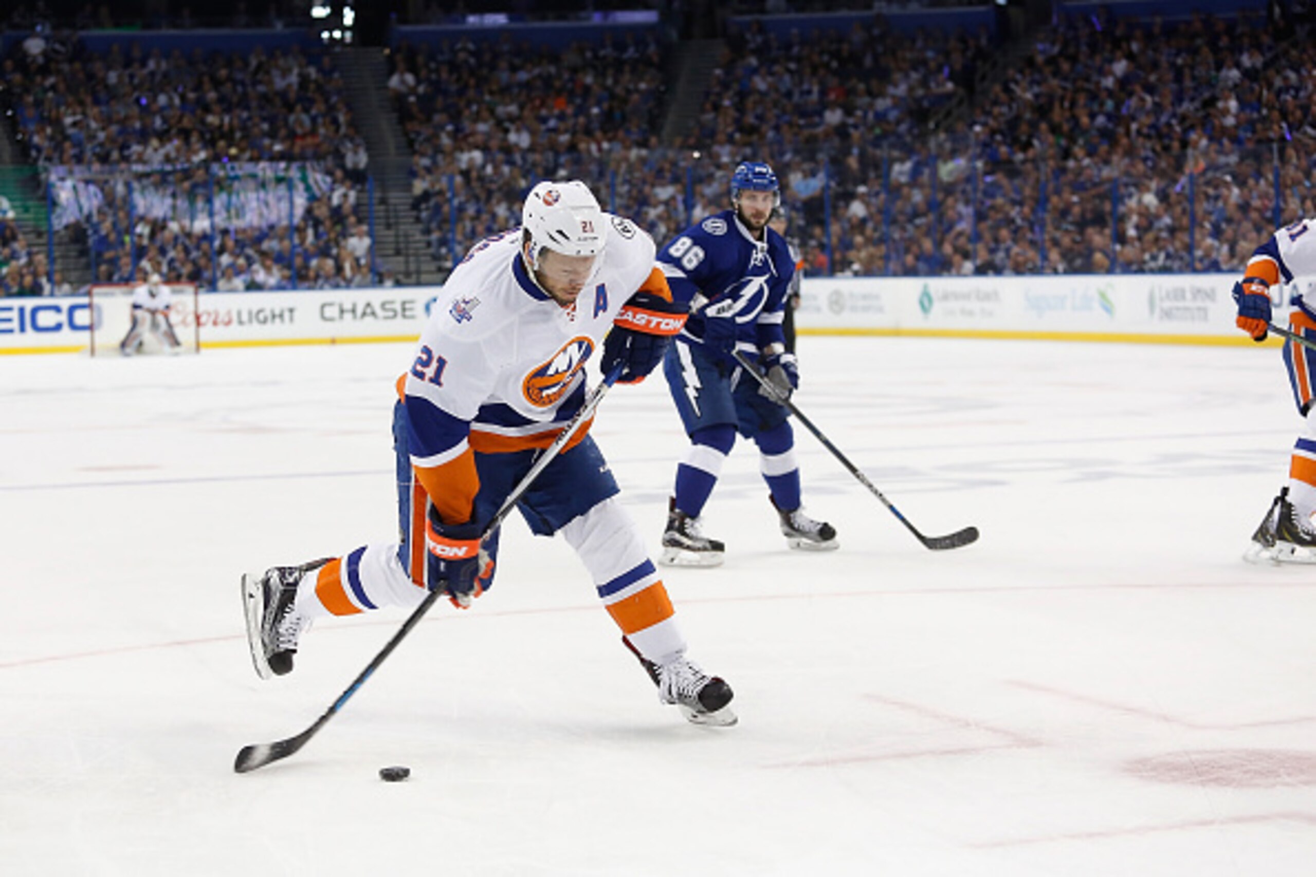 TAMPA, FL - APRIL 30:    Kyle Okposo #21 of the New York Islanders fires the puck in Game Two of the Eastern Conference Second Round during the 2016 NHL Stanley Cup Playoffs at Amalie Arena on April 30, 2016 in Tampa, Florida. (Photo by Scott Iskowitz/Get