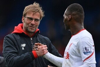 Liverpool's German manager Jurgen Klopp (L) congratulates Liverpool's Zaire-born Belgian striker Christian Benteke after the English Premier League football match between Crystal Palace and Liverpool at Selhurst Park in south London on March 6, 2016.
Live