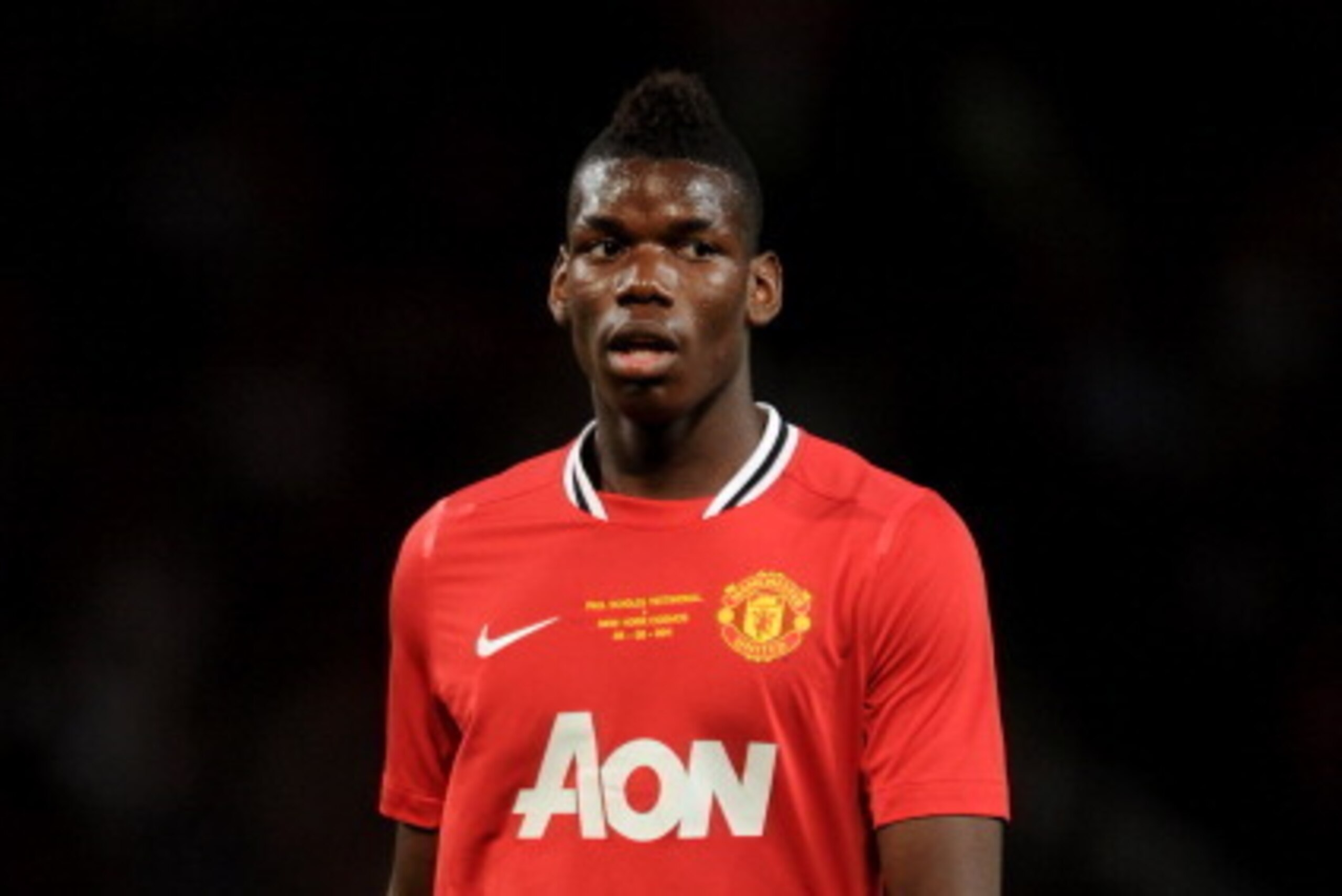 MANCHESTER, ENGLAND - AUGUST 05:  Paul Pogba of Manchester United looks on during Paul Scholes' Testimonial Match between Manchester United and New York Cosmos at Old Trafford on August 5, 2011 in Manchester, England.  (Photo by Chris Brunskill/Getty Imag