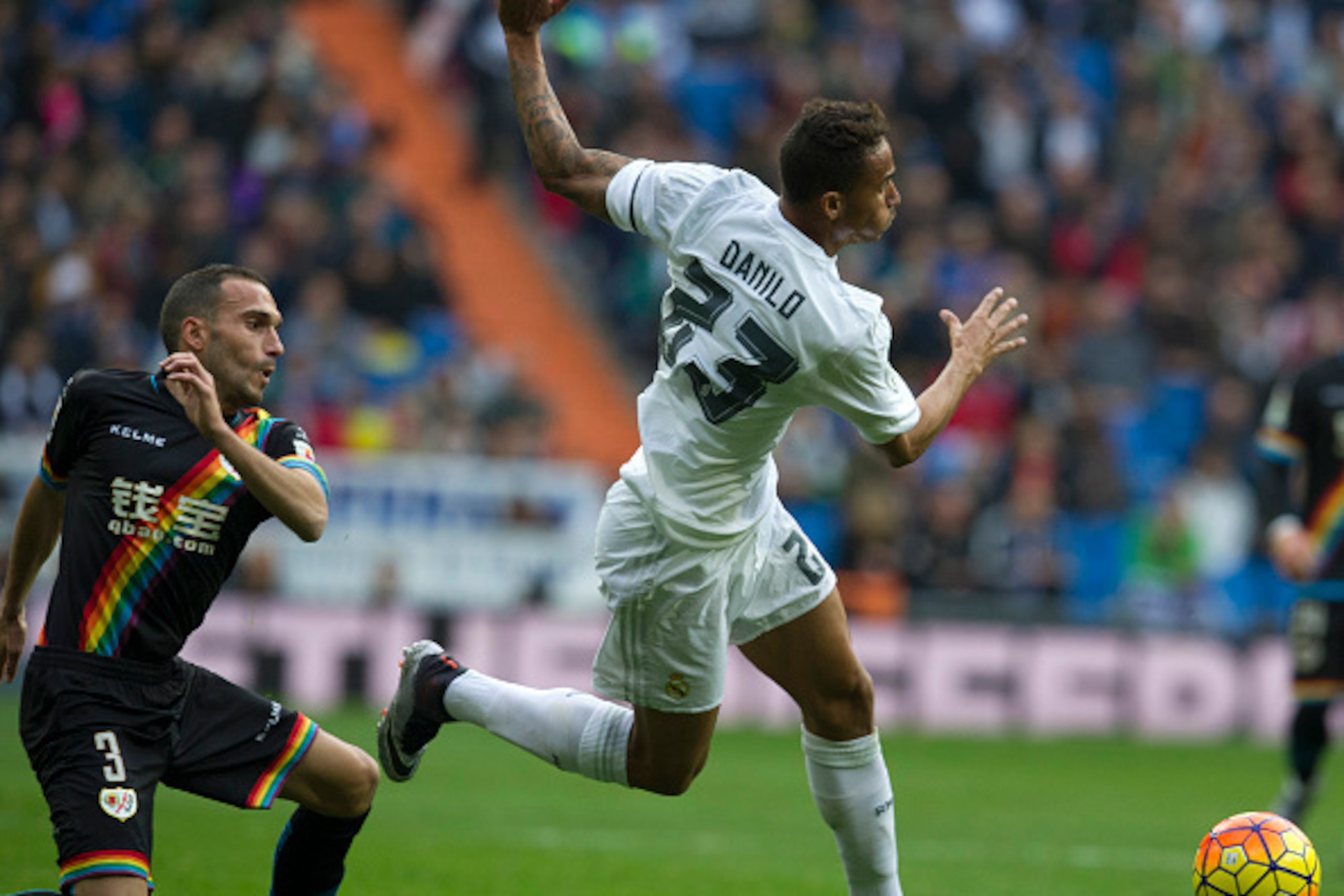 Rayo Vallecano's defender Jose Ignacio Martinez Garcia (L) vies with Real Madrid's Brazilian defender Danilo during the Spanish league football match Real Madrid CF vs Rayo Vallecano de Madrid at the Santiago Bernabeu stadium in Madrid on December 20, 201