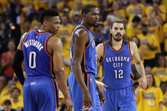 OAKLAND, CA - MAY 30:  Russell Westbrook #0, Kevin Durant #35 and Steven Adams #12 of the Oklahoma City Thunder stand on the court in Game Seven of the Western Conference Finals against the Golden State Warriors during the 2016 NBA Playoffs at ORACLE Aren