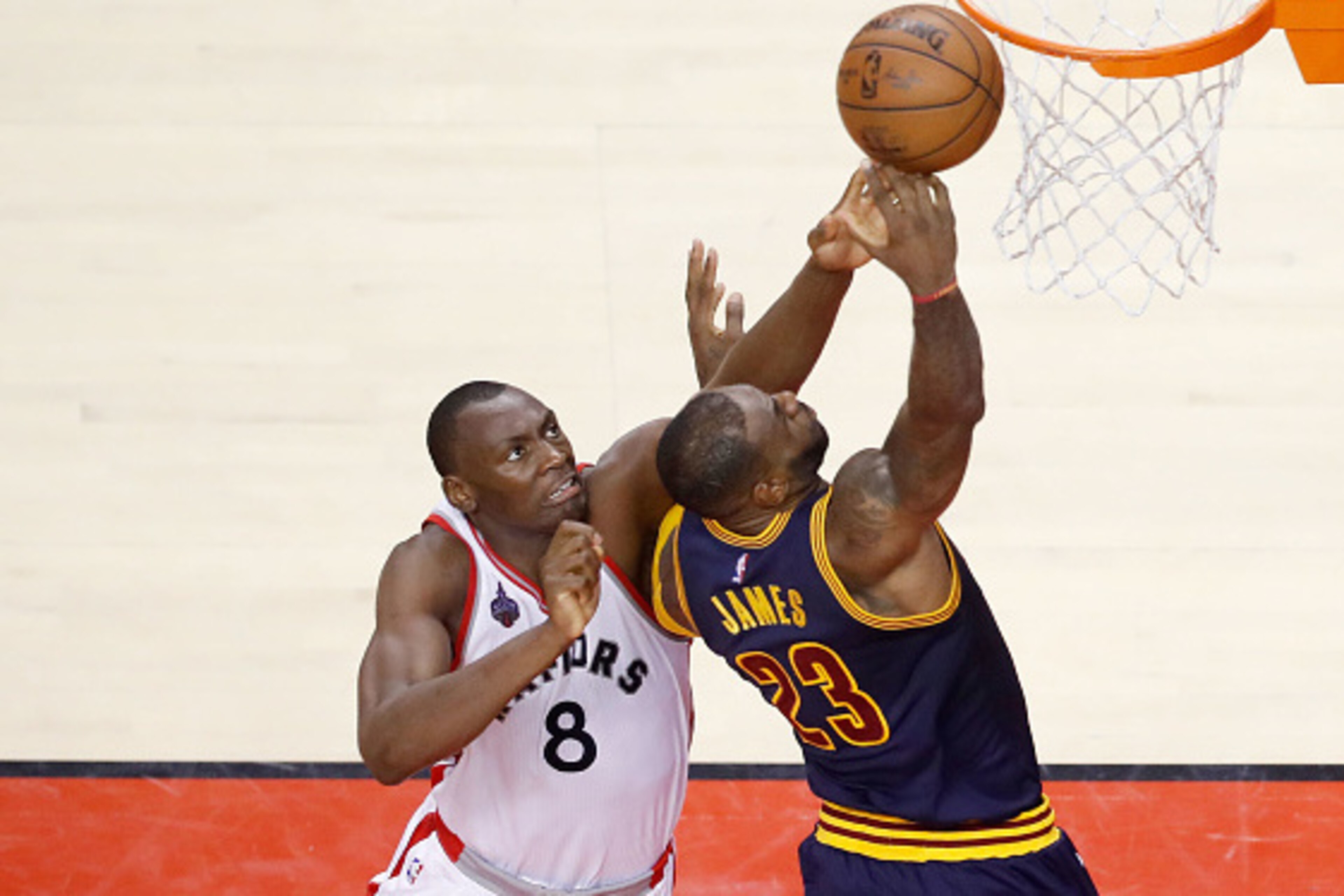 TORONTO, ON - MAY 27:  LeBron James #23 of the Cleveland Cavaliers goes up against Bismack Biyombo #8 of the Toronto Raptors in the second quarter in game six of the Eastern Conference Finals during the 2016 NBA Playoffs at Air Canada Centre on May 27, 20