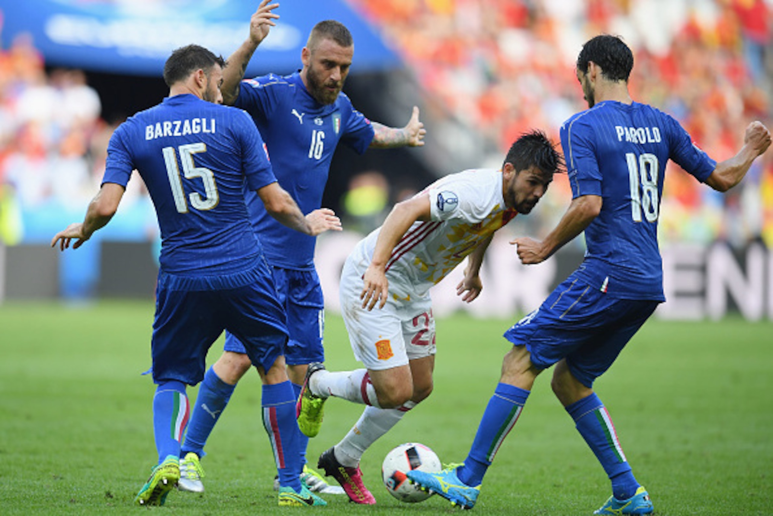 PARIS, FRANCE - JUNE 27:  Nolito (2nd R) of Spain competes for the ball against Marco Parolo (1st R), Daniele De Rossi (2nd L) and Andrea Barzagli (1st L) of Italy during the UEFA EURO 2016 round of 16 match between Italy and Spain at Stade de France on J