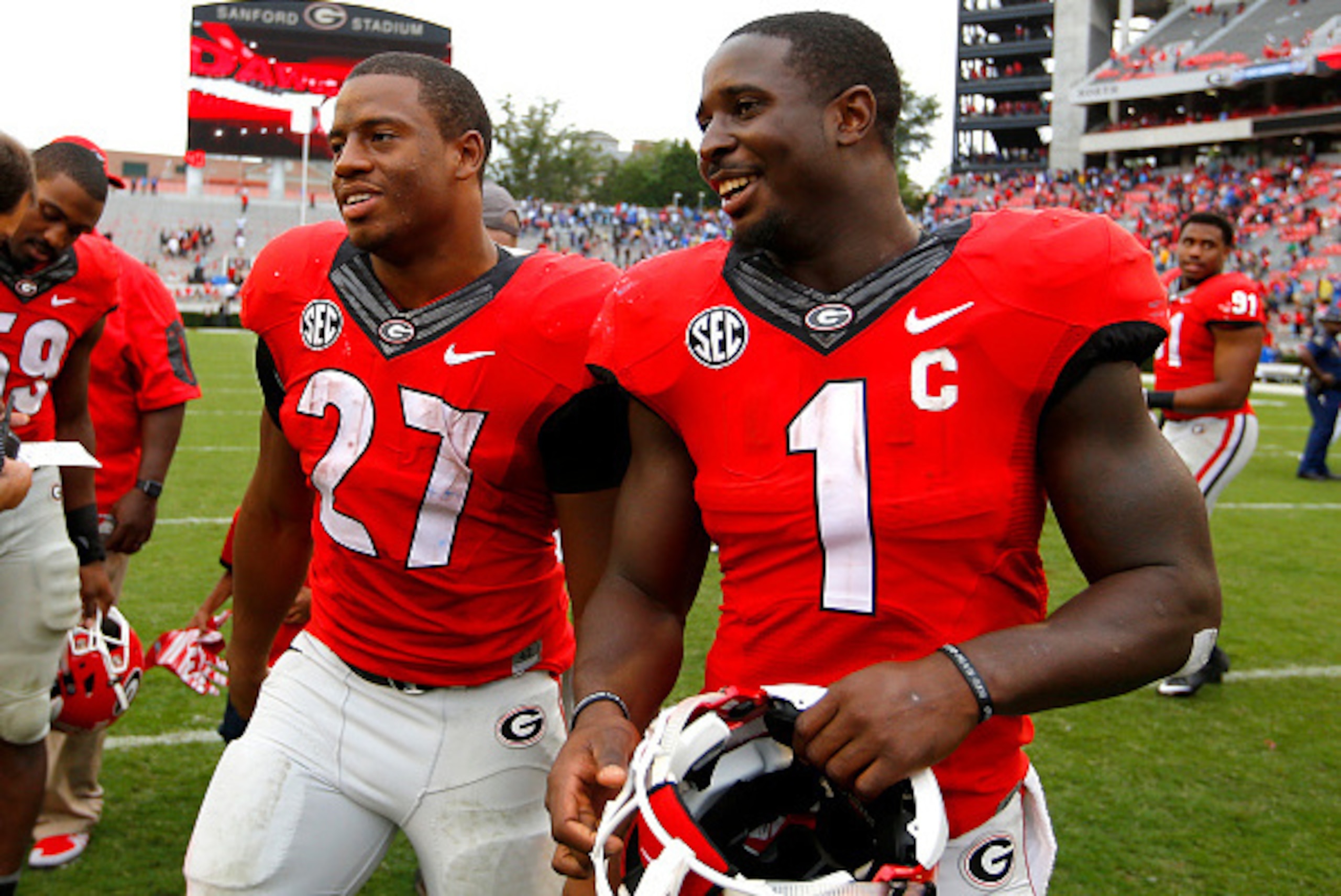 ATHENS, GA - SEPTEMBER 26: Running back Nick Chubb #27 of the Georgia Bulldogs celebrates with running back Sony Michel #1 at the conclusion of the game against the Southern University Jaguars on September 26, 2015 at Sanford Stadium in Athens, Georgia. T