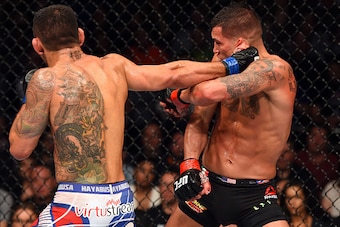 DALLAS, TX - MARCH 14:  (L-R) Rafael dos Anjos of Brazil punches Anthony Pettis in their UFC lightweight championship bout during the UFC 185 event at the American Airlines Center on March 14, 2015 in Dallas, Texas. (Photo by Josh Hedges/Zuffa LLC/Zuffa L