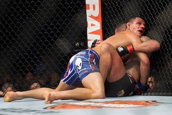 DALLAS, TX - MARCH 14:  Rafael Dos Anjos (top) grapples with Anthony Pettis during UFC 185 at the American Airlines Center on March 14, 2015 in Dallas, Texas. (Photo by Cooper Neill/Zuffa LLC/Zuffa LLC via Getty Images)