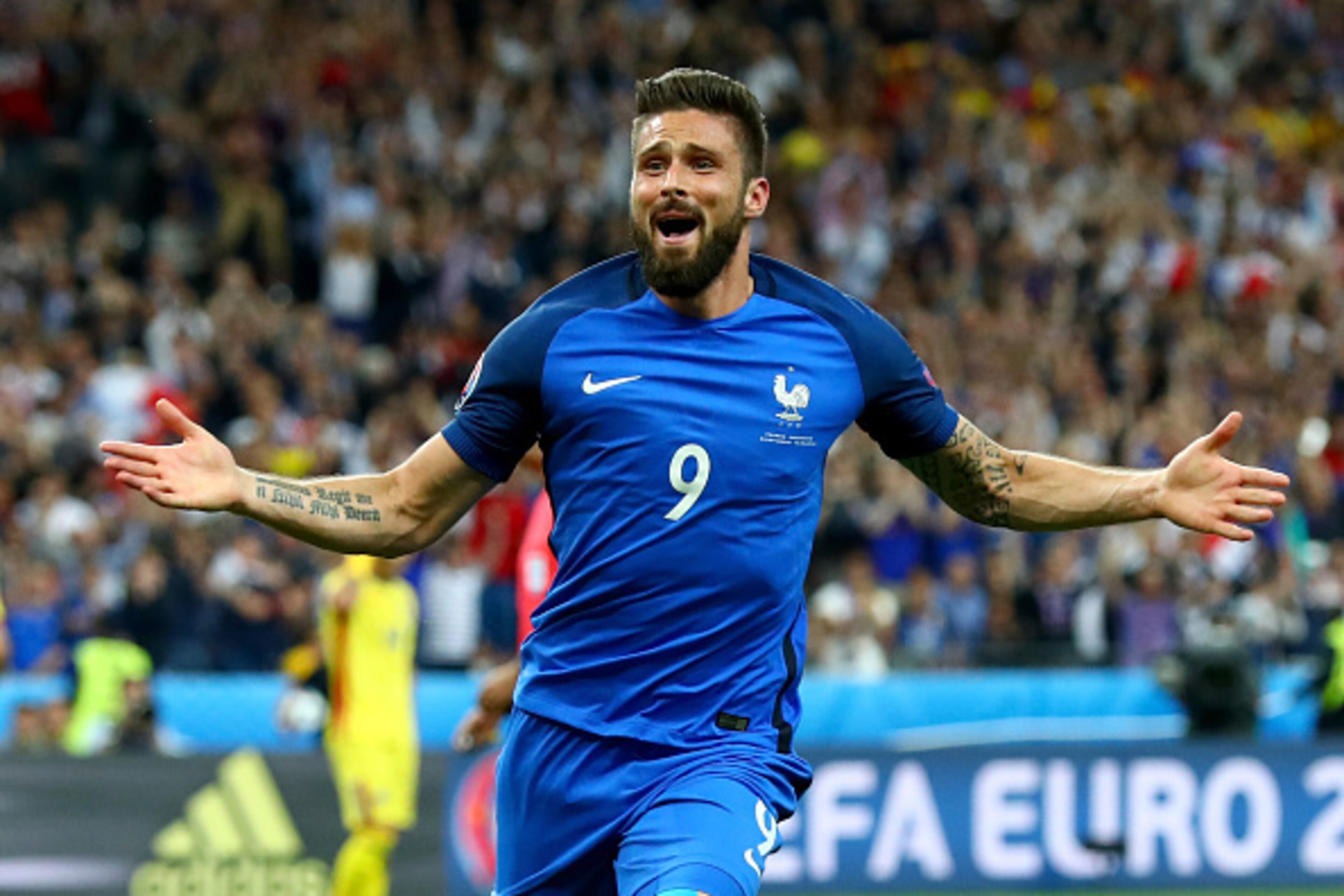 PARIS, FRANCE - JUNE 10:  Olivier Giroud of France celebrates scoring his team's first goal during the UEFA Euro 2016 Group A match between France and Romania at Stade de France on June 10, 2016 in Paris, France.  (Photo by Clive Rose/Getty Images)