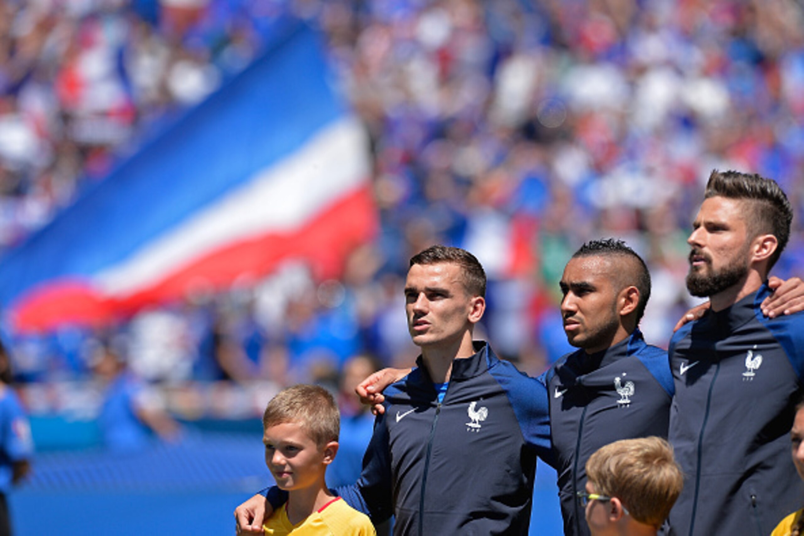 LYON, FRANCE - JUNE 26:  Antoine Griezmann, Dimitri Payet, Olivier Giroud of France react during the national anthem before the UEFA Euro 2016 round of 16 match between France and the Republic of Ireland at Stade des Lumieres on June 26, 2016 in Lyon, Fra