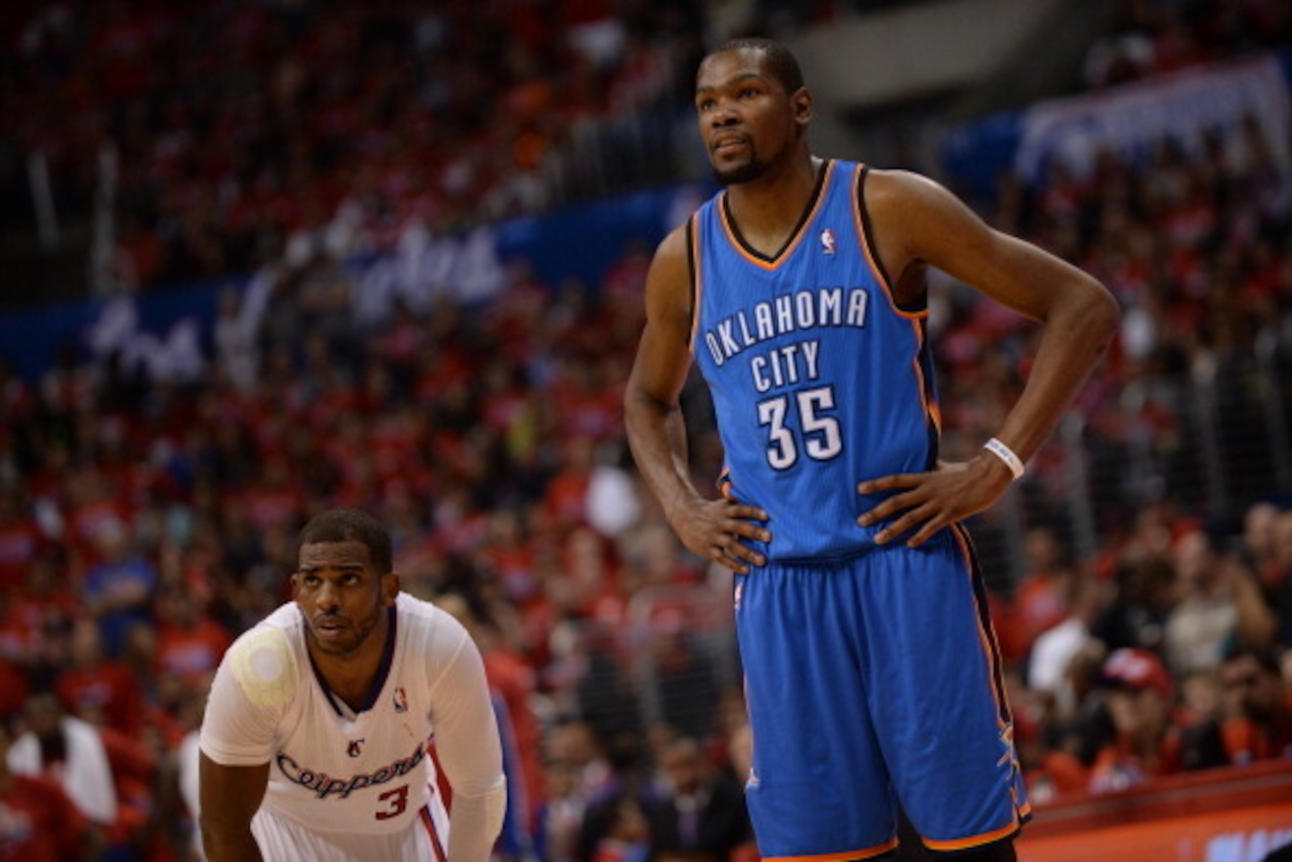 LOS ANGELES, CA - MAY 9: Chris Paul #3 of the Los Angeles Clippers stands on the court during a game against Kevin Durant #35 of the Oklahoma City Thunder look on in Game Three of the Western Conference Semifinals during the 2014 NBA Playoffs at Staples C