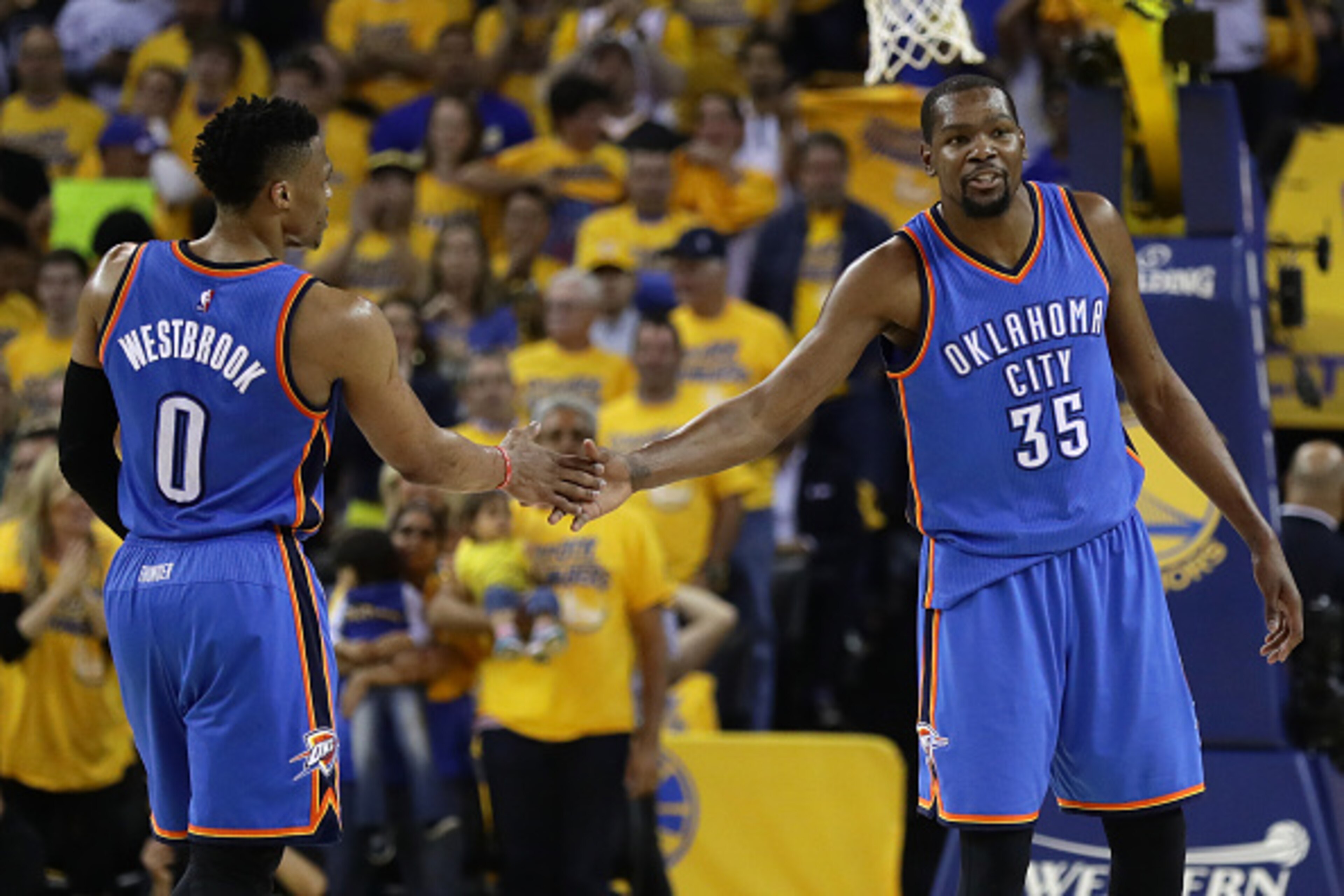 OAKLAND, CA - MAY 26:  Russell Westbrook #0 and Kevin Durant #35 of the Oklahoma City Thunder celebrate after a play against the Golden State Warriors during Game Five of the Western Conference Finals during the 2016 NBA Playoffs at ORACLE Arena on May 26