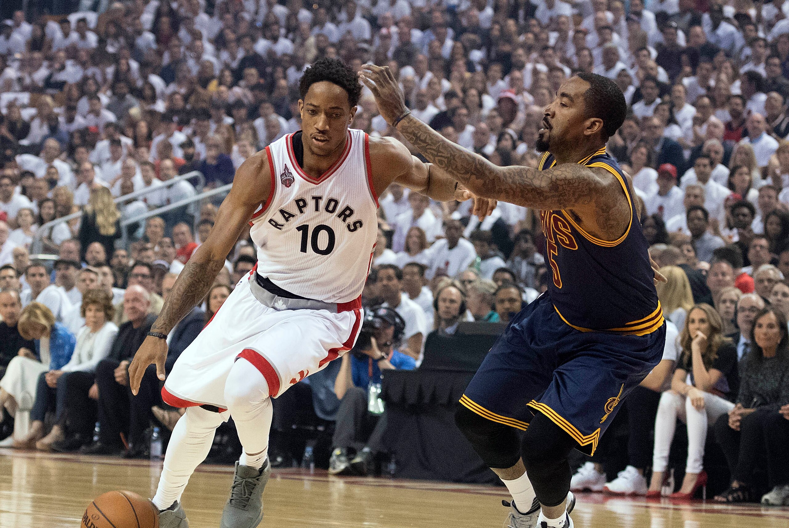 May 23, 2016; Toronto, Ontario, CAN; Toronto Raptors guard DeMar DeRozan (10) drives to the basket as Cleveland Cavaliers guard J.R. Smith (5) tries to defend during the first quarter in game four of the Eastern conference finals of the NBA Playoffs at Ai