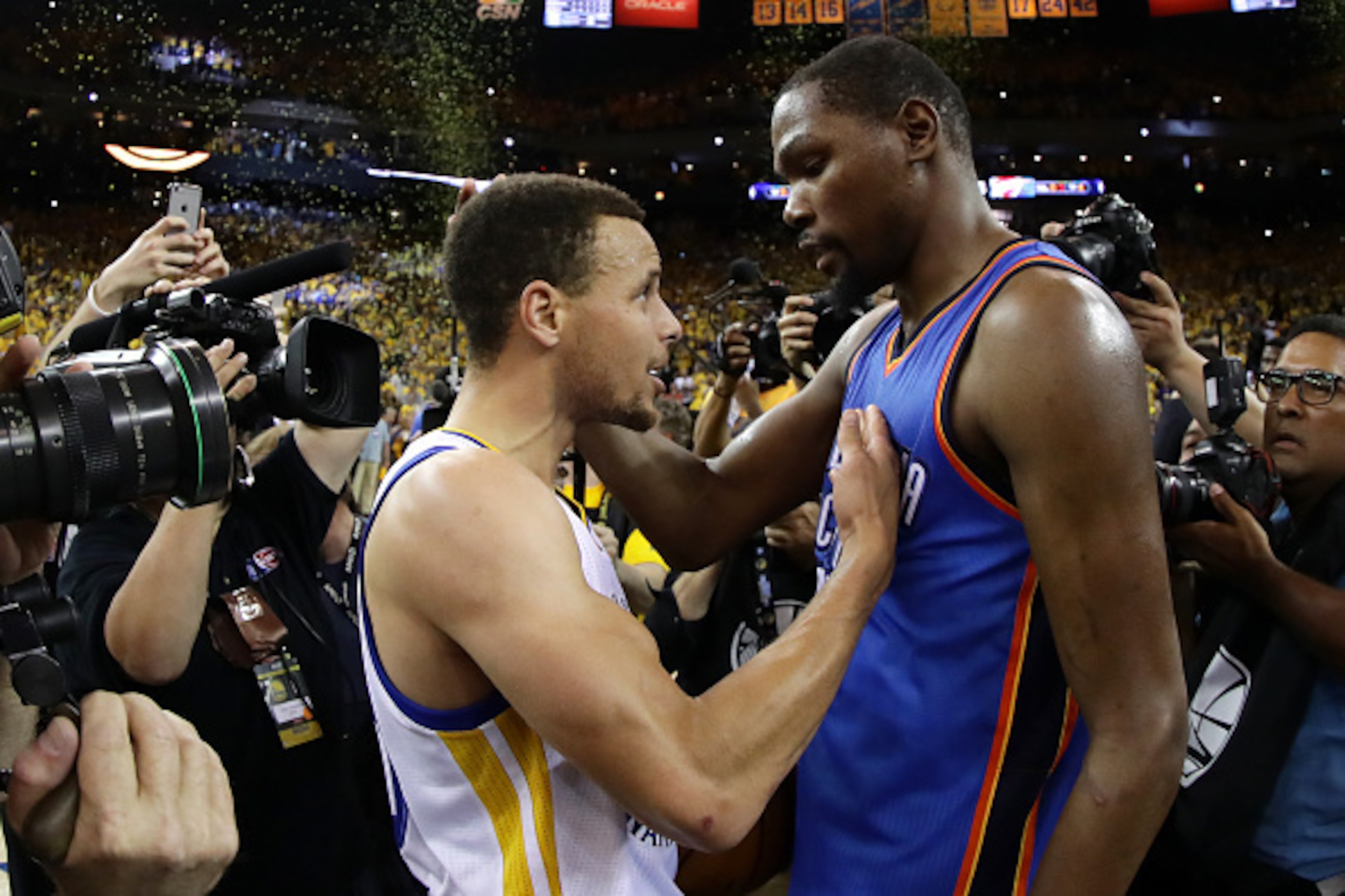 OAKLAND, CA - MAY 30:  Stephen Curry #30 of the Golden State Warriors speaks with Kevin Durant #35 of the Oklahoma City Thunder after their 96-88 win in Game Seven of the Western Conference Finals during the 2016 NBA Playoffs at ORACLE Arena on May 30, 20
