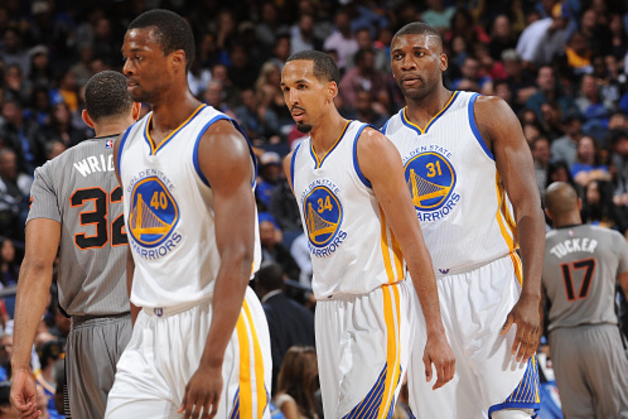 OAKLAND, CA - APRIL 2: Teammates Harrison Barnes #40, Shaun Livingston #34, and Festus Ezeli #31 of the Golden State Warriors while facing the Phoenix Suns on April 2, 2015 at Oracle Arena in Oakland, California. NOTE TO USER: User expressly acknowledges 