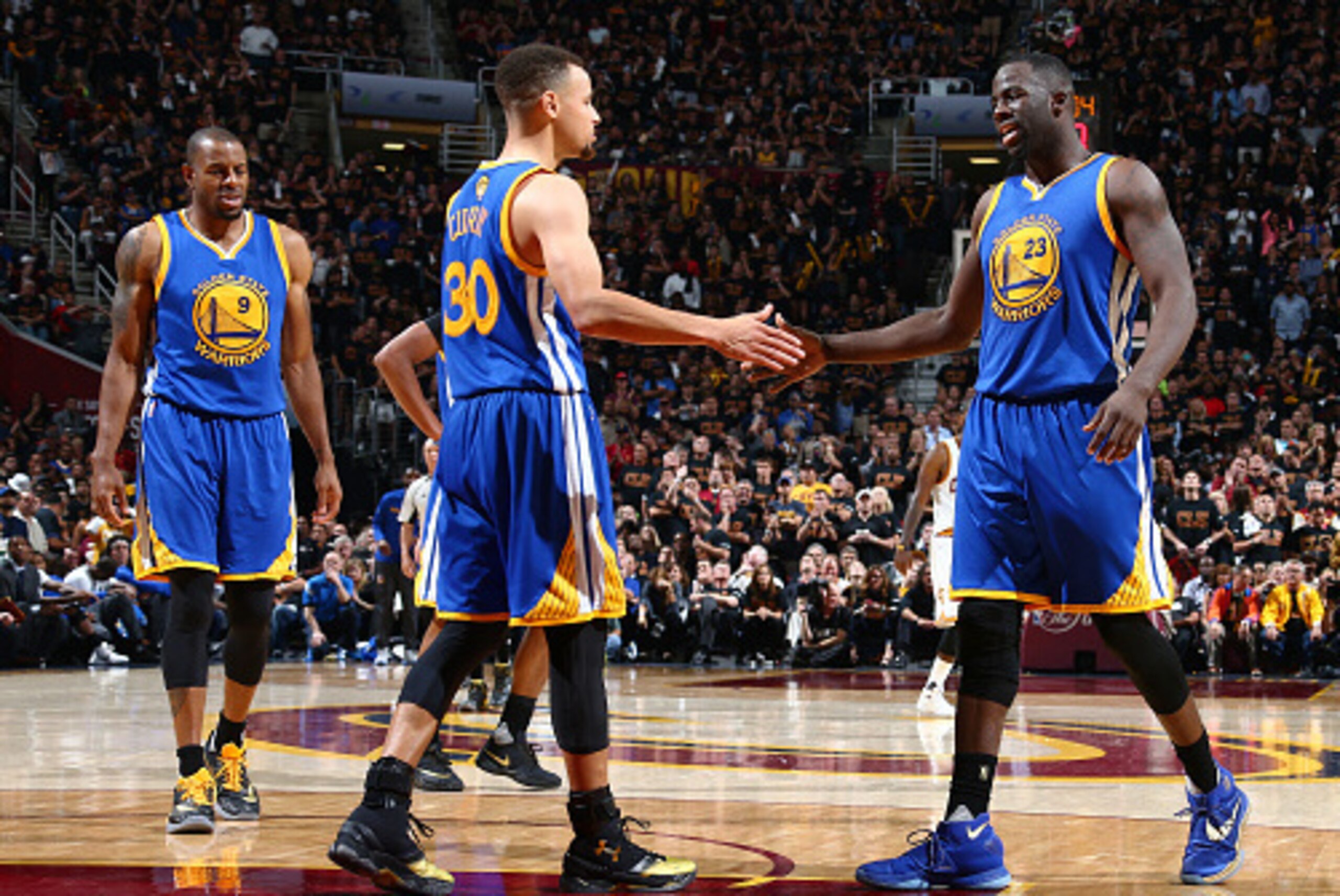 CLEVELAND, OH - JUNE 16: Stephen Curry #30 and Draymond Green #23 of the Golden State Warriors celebrate against the Cleveland Cavaliers in Game Six of the 2016 NBA Finals on June 16, 2016 at Quicken Loans Arena in Cleveland, Ohio.  NOTE TO USER: User exp