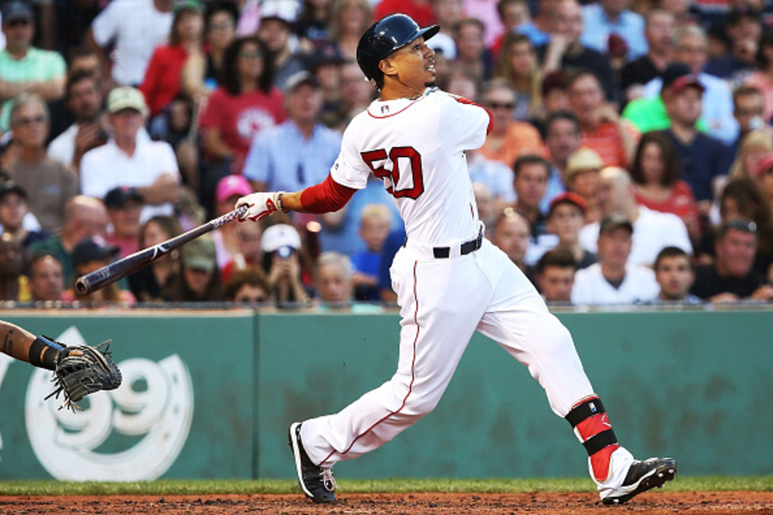 BOSTON, MA - JUNE 21:  Mookie Betts #50 of the Boston Red Sox bats in the second inning during the game against the Chicago White Sox at Fenway Park on June 21, 2016 in Boston, Massachusetts.  (Photo by Adam Glanzman/Getty Images)