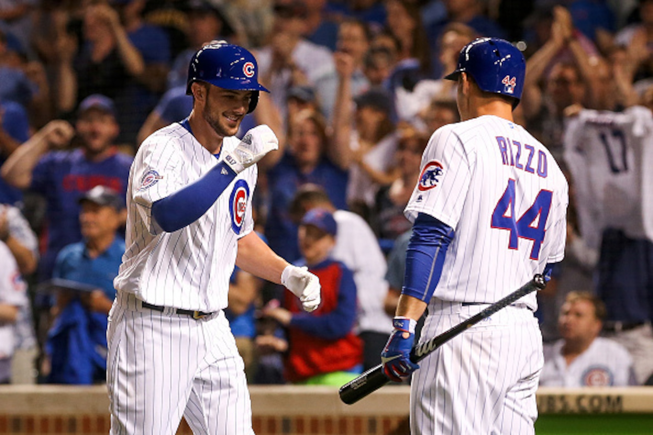 CHICAGO, IL - JUNE 18:  Kris Bryant #17 of the Chicago Cubs is congratulated by teammate Anthony Rizzo #44 after hitting a home run against the Pittsburgh Pirates at Wrigley Field on June 18, 2016 in Chicago, Illinois. (Photo by Dylan Buell/Getty Images)