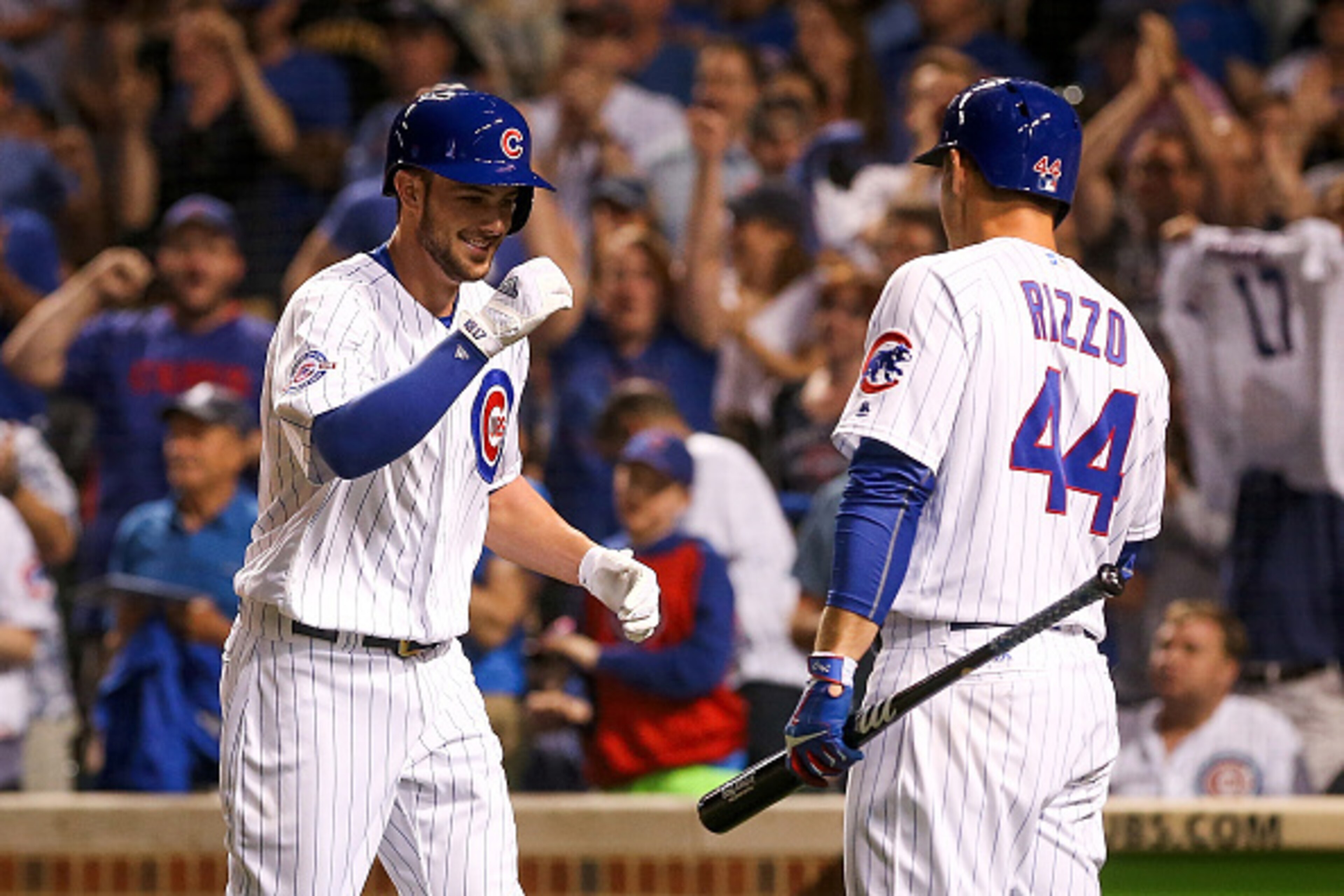 CHICAGO, IL - JUNE 18:  Kris Bryant #17 of the Chicago Cubs is congratulated by teammate Anthony Rizzo #44 after hitting a home run against the Pittsburgh Pirates at Wrigley Field on June 18, 2016 in Chicago, Illinois. (Photo by Dylan Buell/Getty Images)