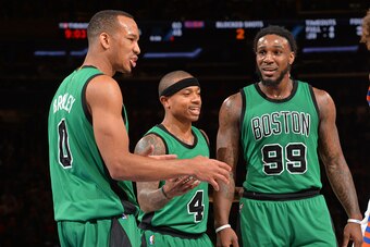 NEW YORK,NY - JANUARY 12: Avery Bradley #0 , Isaiah Thomas #4 and Jae Crowder #99 of the Boston Celtics talk things over against the New York Knicks at Madison Square Garden on January 12, 2016 in New York,New York NOTE TO USER: User expressly acknowledge