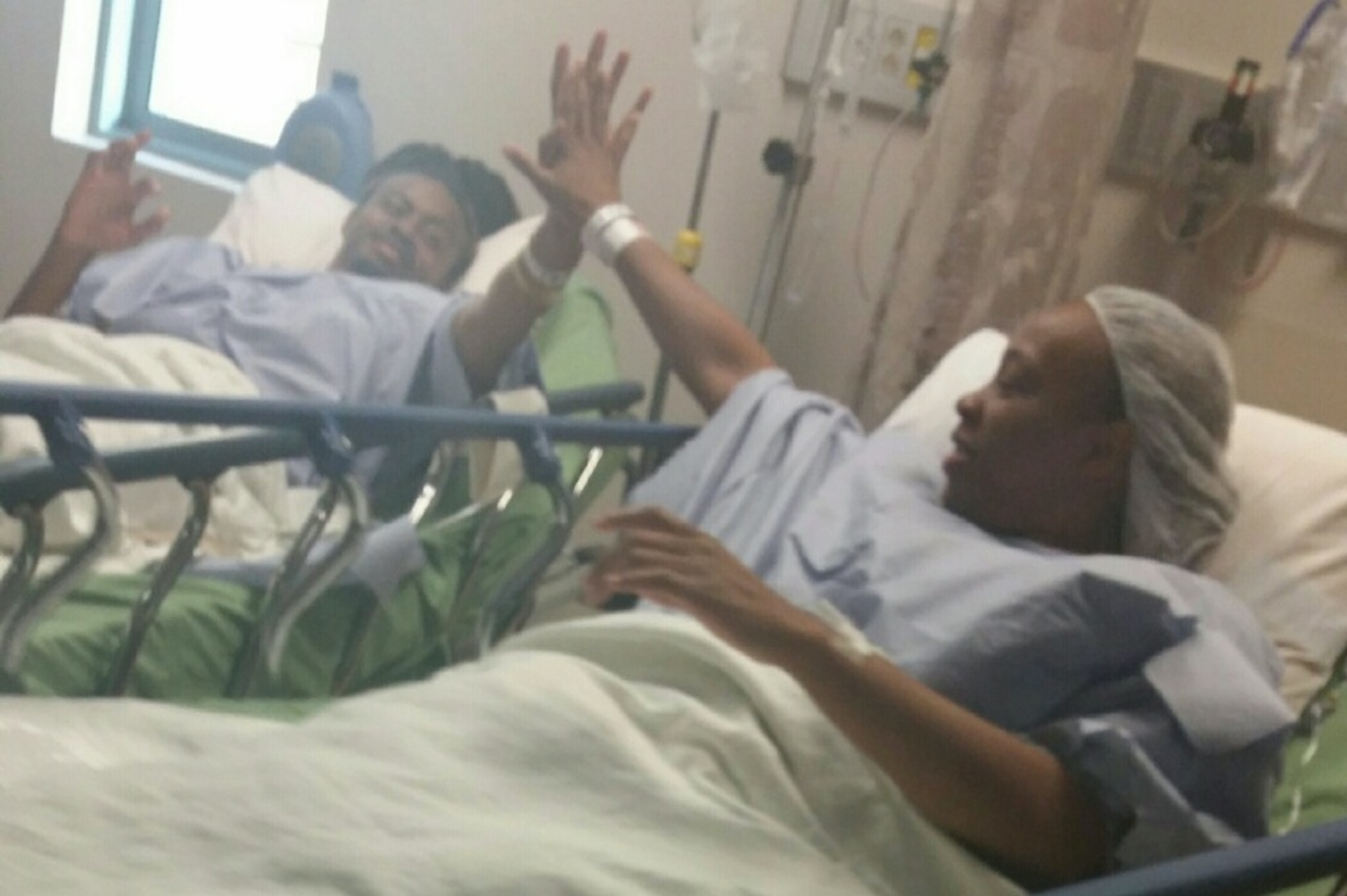 Aries Merritt high-fives his older sister—and kidney donor—LaToya Hubbard.