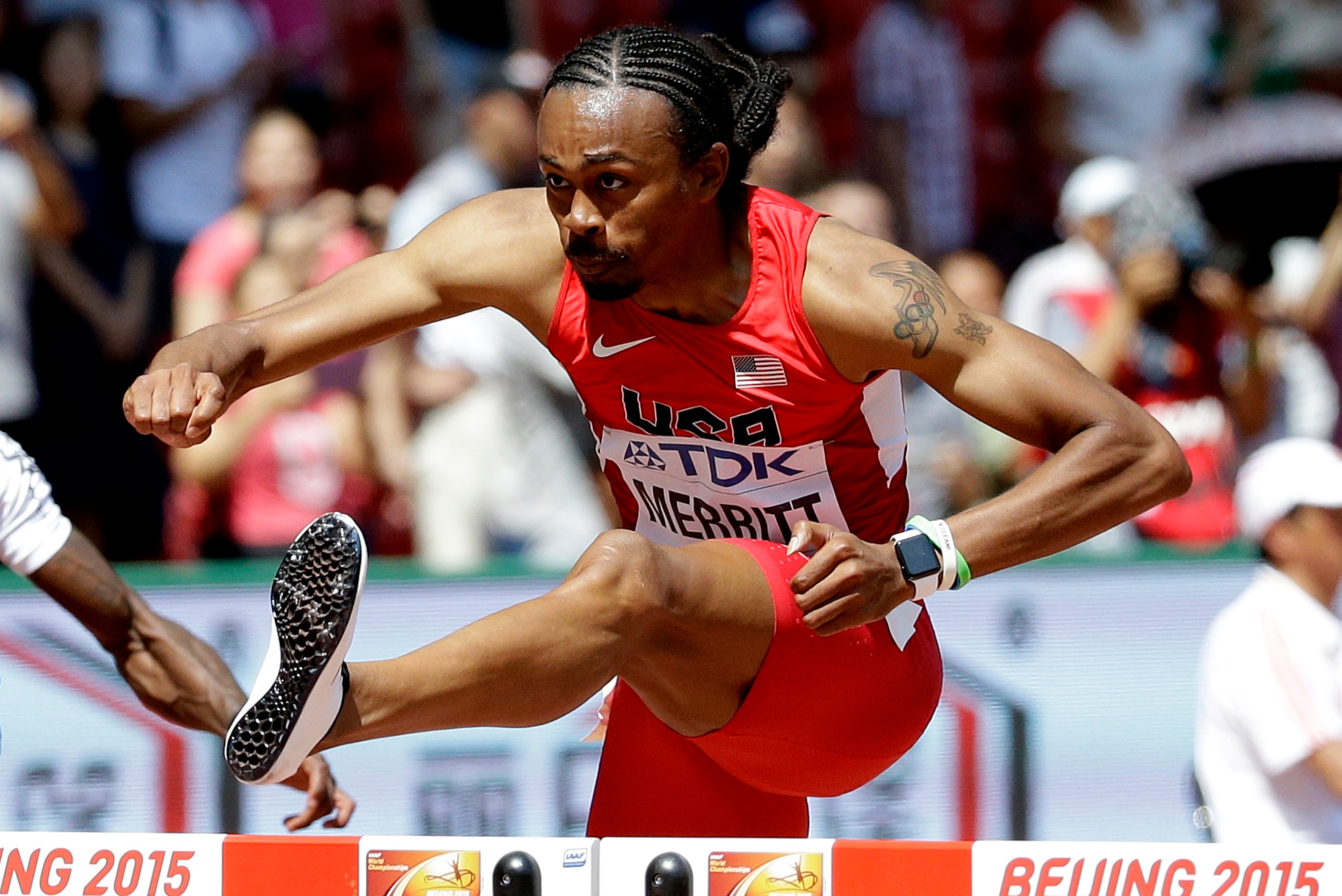Merritt clears a hurdle during a heat at the World Championships in Beijing on August 25, 2015, a few days before his kidney transplant.