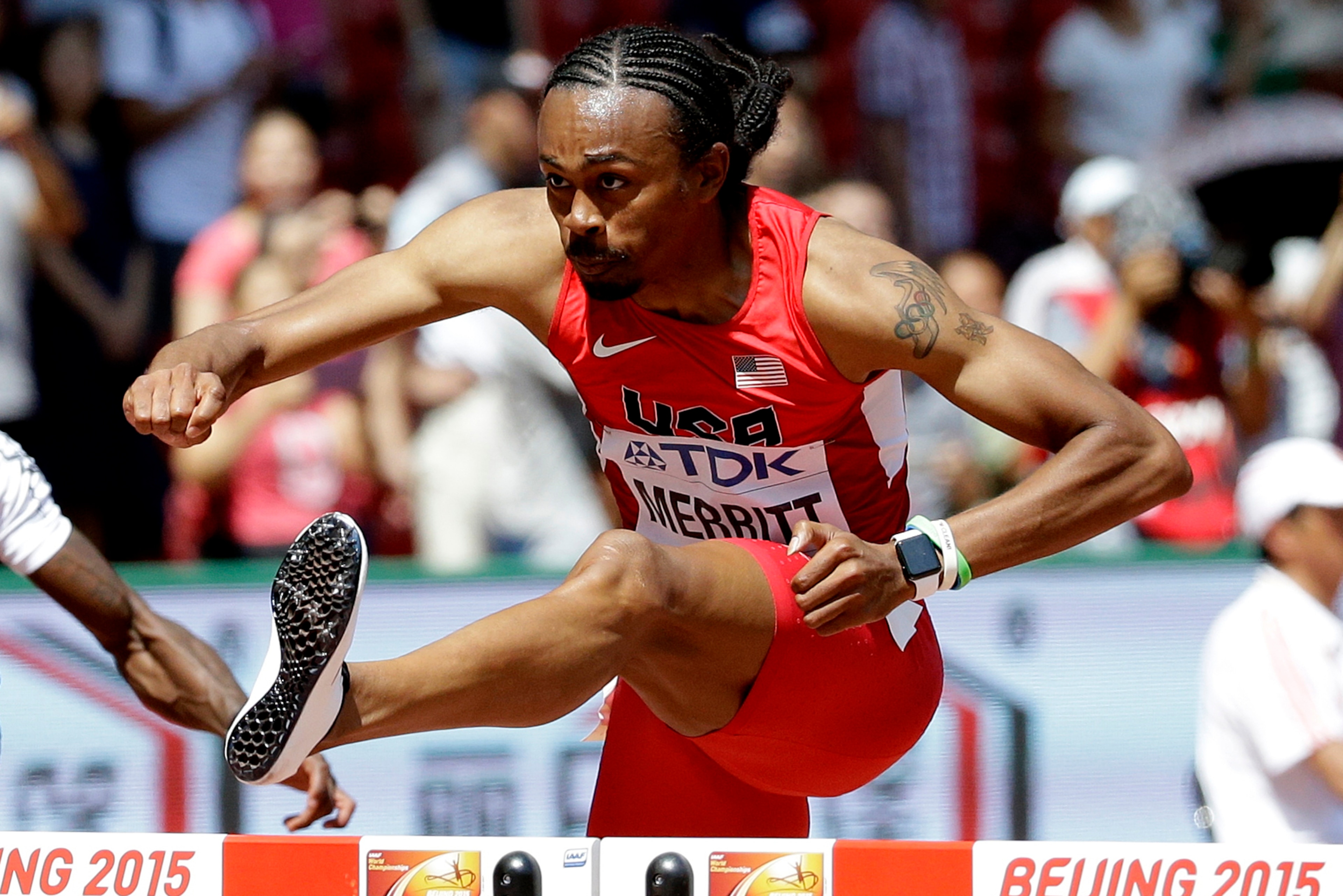 Merritt clears a hurdle during a heat at the World Championships in Beijing on August 25, 2015, a few days before his kidney transplant.