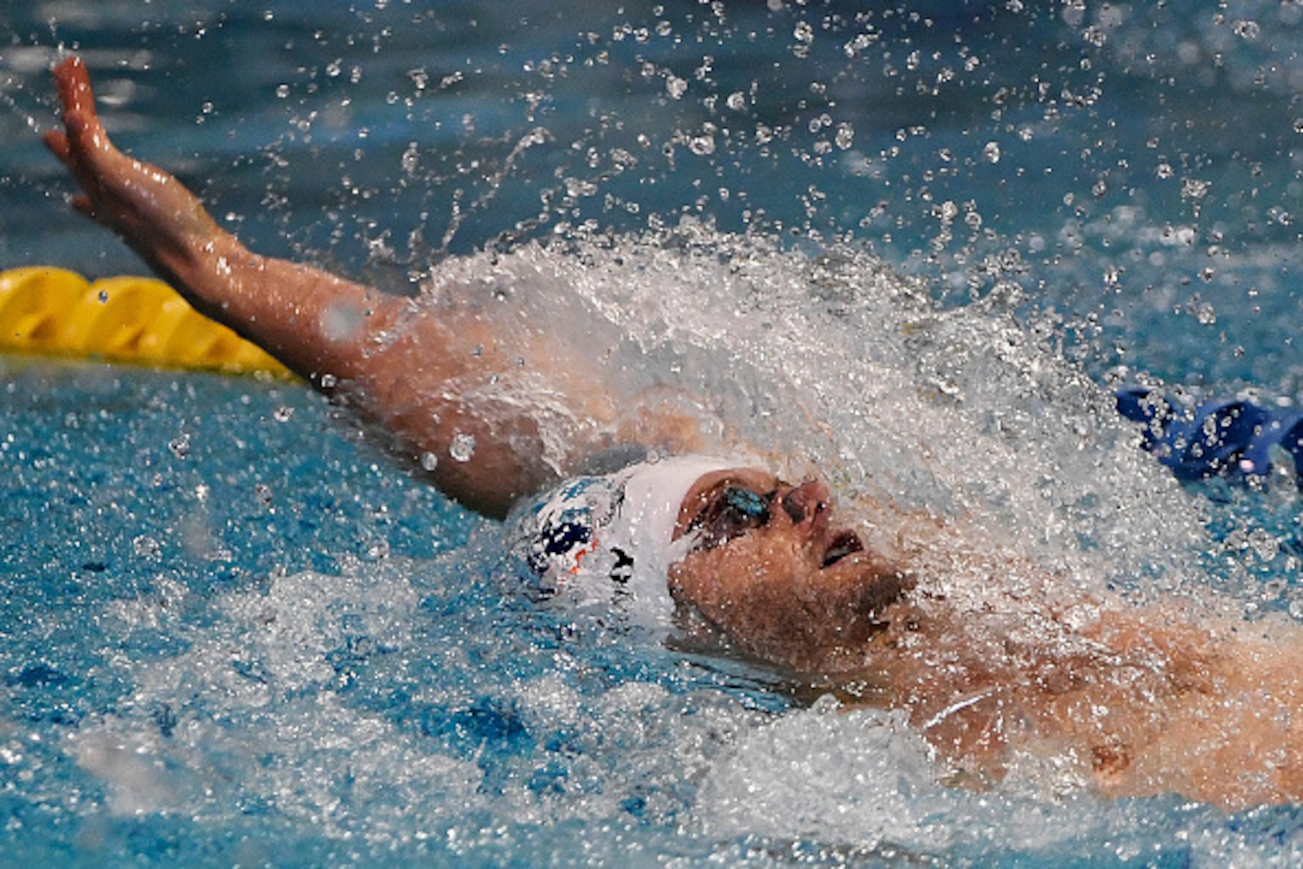 CHARLOTTE, NC - MAY 15: Tyler Clary of swims to a second place finish in the men's 200m backstroke during the 2016 Arena Pro Swim Series at Charlotte swim meet at the Mecklenburg County Aquatic Center on May 15, 2016 in Charlotte, North Carolina. (Photo b