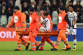 TURIN, ITALY - FEBRUARY 03:  Martin Caceres of Juventus FC is helped from the pitch after sustaining an injury during the Serie A match between Juventus FC and Genoa CFC at Juventus Arena on February 3, 2016 in Turin, Italy.  (Photo by Valerio Pennicino/G