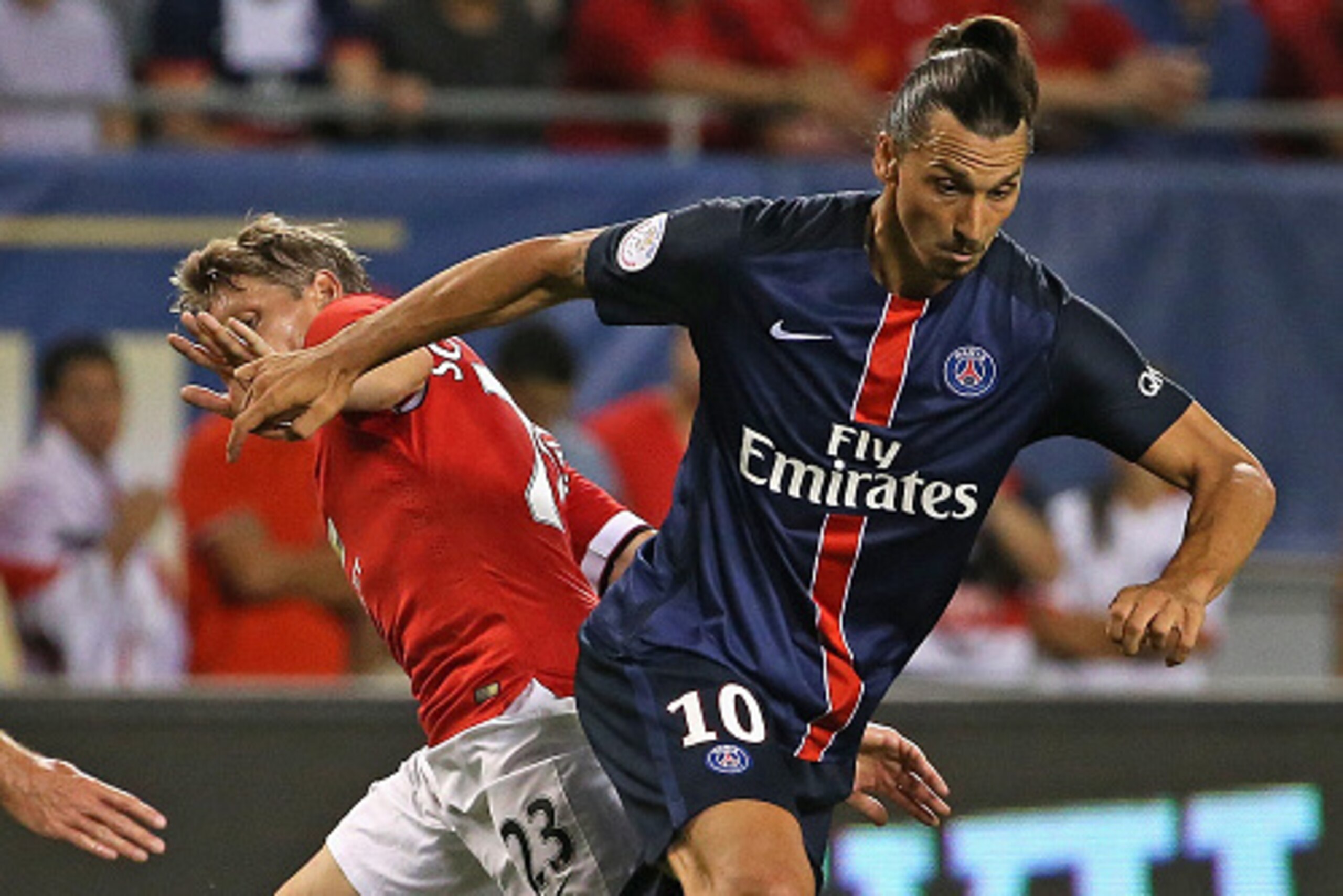 CHICAGO, IL - JULY 29: Zlatan Ibrahimovic #10 of Paris Saint-Germain moves around Bastain Schweinsteiger #23 of Manchester United during a match in the 2015 International Champions Cup at Soldier Field on July 29, 2015 in Chicago, Illinois. (Photo by Jona