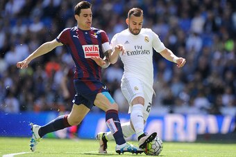 MADRID, SPAIN - APRIL 09:  Jese Rodriguez of Real Madrid is tackled by Dani Garcia of Eibar during the La Liga match between Real Madrid and Eibar at Estadio Santiago Bernabeu on April 9, 2016 in Madrid, Spain.  (Photo by Denis Doyle/Getty Images)