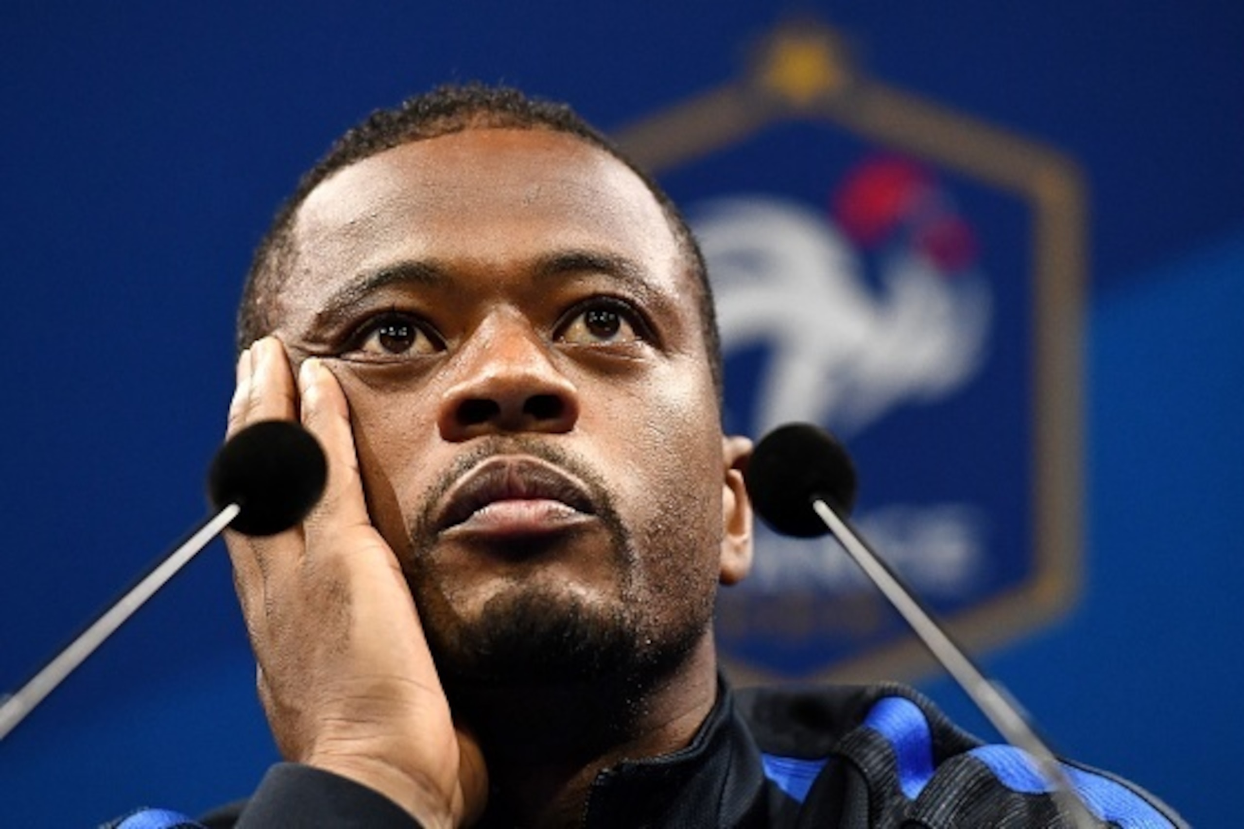 France's defender Patrice Evra smiles during a press conference in Clairefontaine en Yvelines on June 30, 2016, during the Euro 2016 football tournament.   / AFP / FRANCK FIFE        (Photo credit should read FRANCK FIFE/AFP/Getty Images)