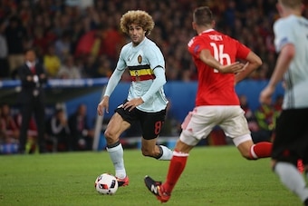 Marouane Fellaini of Belgium, Joe Ledley of Wales during the UEFA EURO 2016 quarter final match between Wales and Belgium on July 2, 2016 at the Stade Pierre Mauroy in Lille, France.(Photo by VI Images via Getty Images)