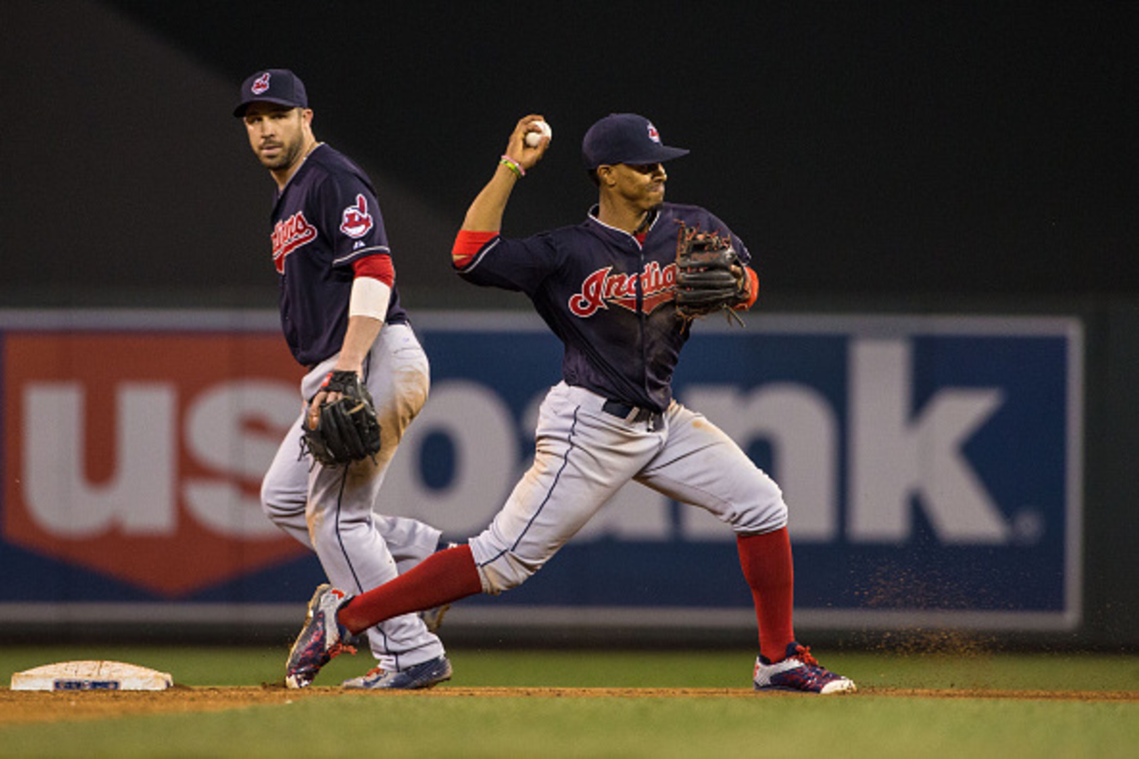 MINNEAPOLIS, MN- SEPTEMBER 24: Francisco Lindor #12 of the Cleveland Indians throws and turns a double play with Jason Kipnis #22 against the Minnesota Twins on September 24, 2015 at Target Field in Minneapolis, Minnesota. The Indians defeated the Twins 6