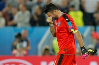 Buffon leaves the field after coming agonizingly close to ending the shootout in Italy's favor.