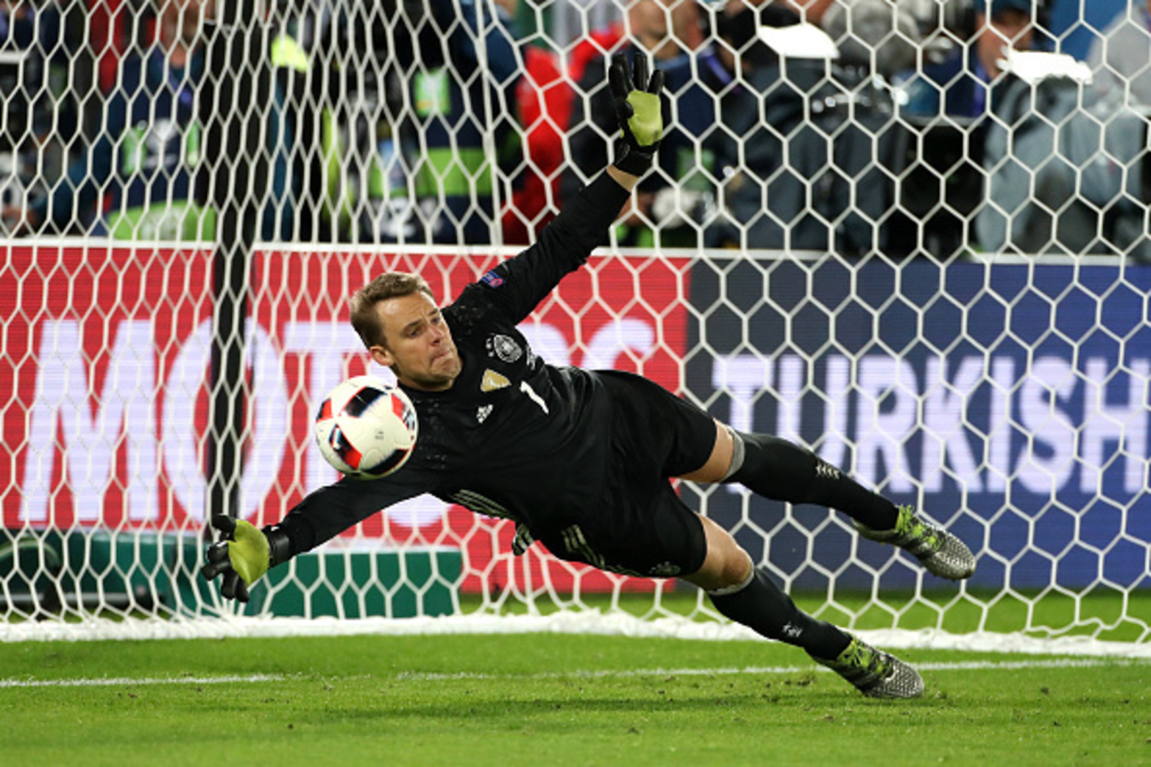 BORDEAUX, FRANCE - JULY 2: Goalkeeper of Germany Manuel Neuer stops the ball during the penalty shootout of the UEFA Euro 2016 quarter final match between Germany and Italy at Stade Matmut Atlantique on July 2, 2016 in Bordeaux, France. (Photo by Jean Cat