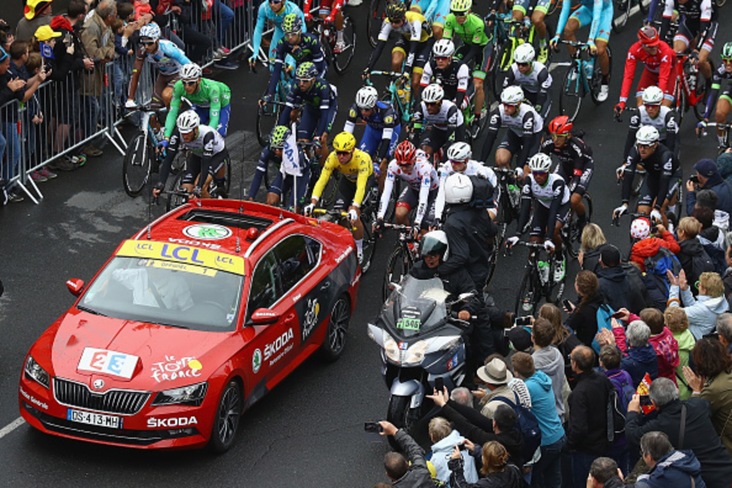 Race leader Mark Cavendish of Great Britain and Dimension Data leads the peloton out of Saint-Lo at the start of stage two of the 2016 Tour de France from  Saint-Lo to Cherbourg-Octeville on July 3, 2016 in Cherbourg, France.  (Photo by Bryn Lennon/Getty 