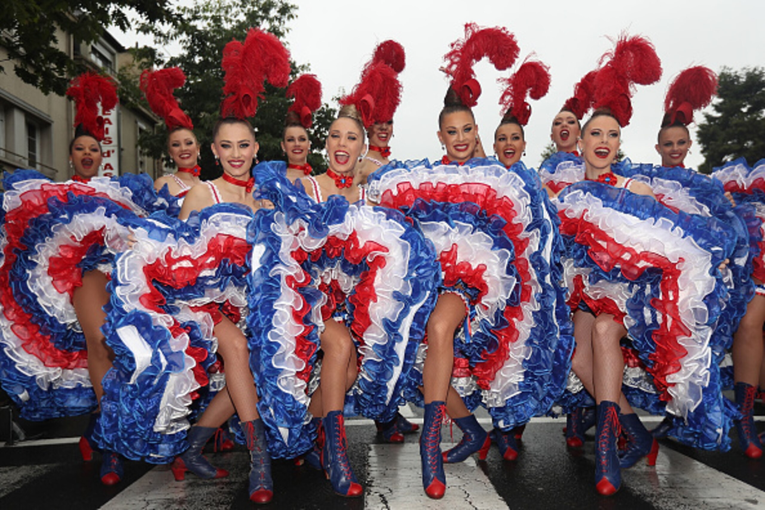 SAINT-L, FRANCE - JULY 03:  LY 03:  LY 03:  Dancers from the Moulin Rouge pose for a photo prior to stage two of the 2016 Le Tour de France a 183km stage from Saint-L to Cherbourg-en-Cotentin on July 3, 2016 in Saint- L, France.  (Photo by Chris Graythen/