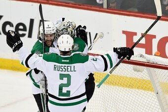 ST PAUL, MN - APRIL 20: (L-R) Jason Demers #4, goalie Antti Niemi #31 and Kris Russell #2 of the Dallas Stars celebrate a win against the Minnesota Wild of Game Four of the Western Conference First Round during the 2016 NHL Stanley Cup Playoffs on April 2