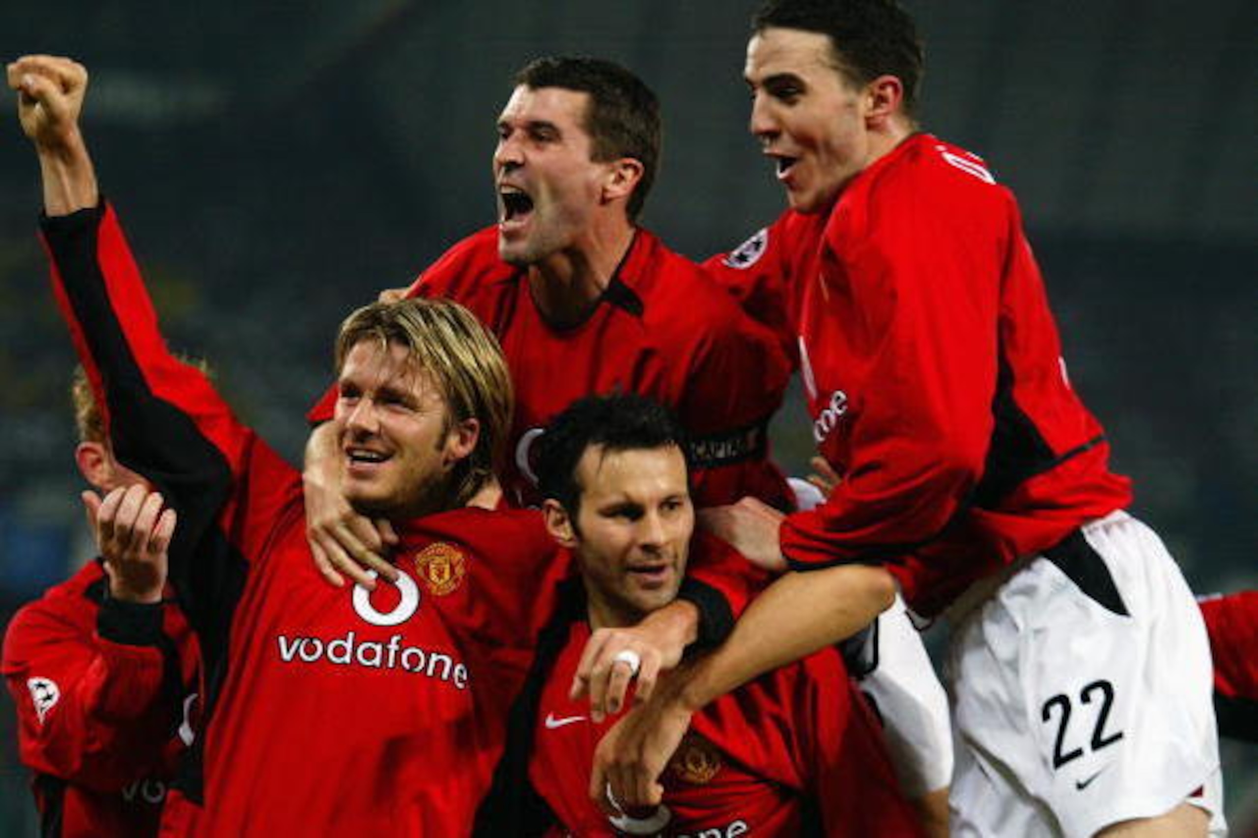 TURIN - FEBRUARY 25:  Manchester United players David Beckham, Roy Keane and John O'Shea celebrate team-mate Ryan Giggs superb second goal during the UEFA Champions League Second Phase Group D match between Juventus and Manchester United held on February 
