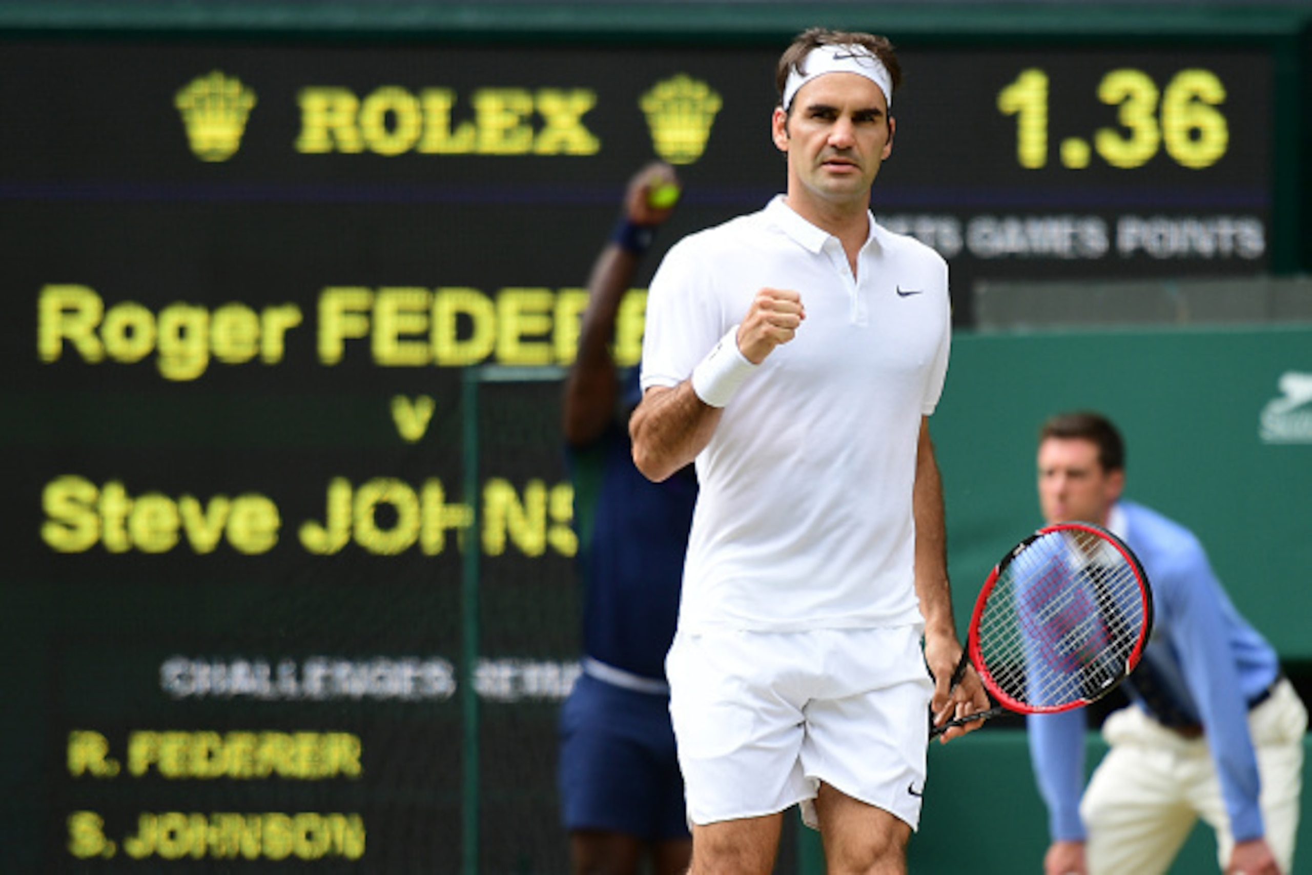 Switzerland's Roger Federer celebrates winning a point against US Steve Johnson during their men's singles fourth round match on the eighth day of the 2016 Wimbledon Championships at The All England Lawn Tennis Club in Wimbledon, southwest London, on July