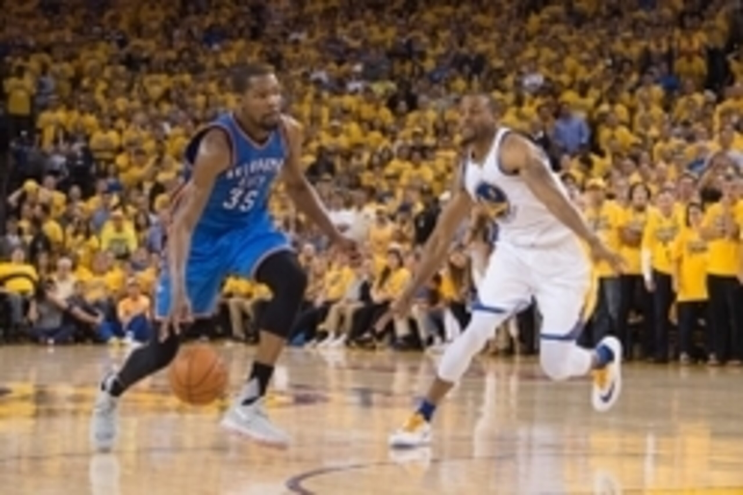 May 30, 2016; Oakland, CA, USA; Oklahoma City Thunder forward Kevin Durant (35) dribbles the basketball against Golden State Warriors forward Andre Iguodala (9) during the fourth quarter in game seven of the Western conference finals of the NBA Playoffs a