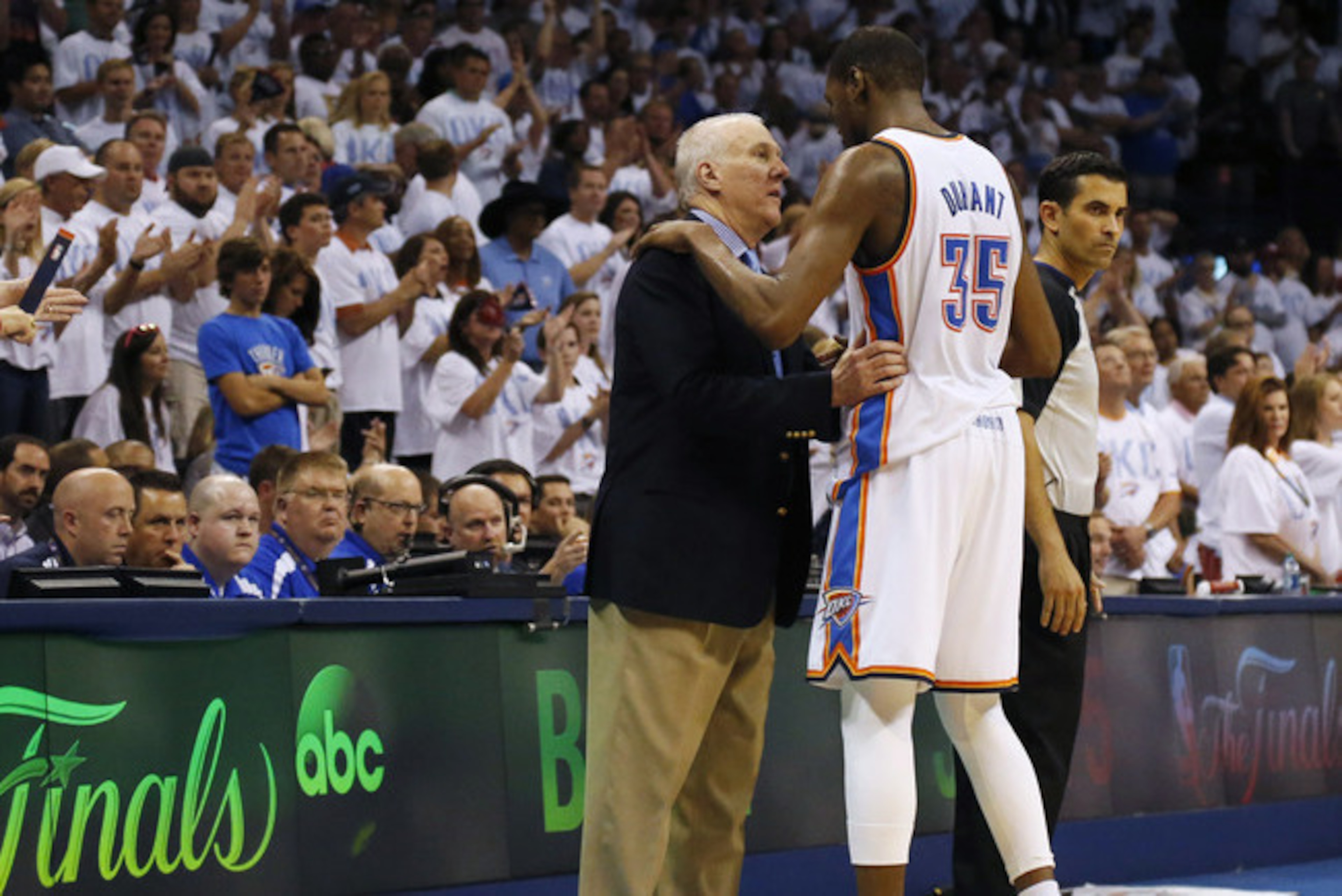 San Antonio Spurs head coach Gregg Popovich shares a moment with Kevin Durant during their 2014 playoff series. San Antonio Spurs head coach Gregg Popovich shares a moment with Kevin Durant during their 2014 playoff series.