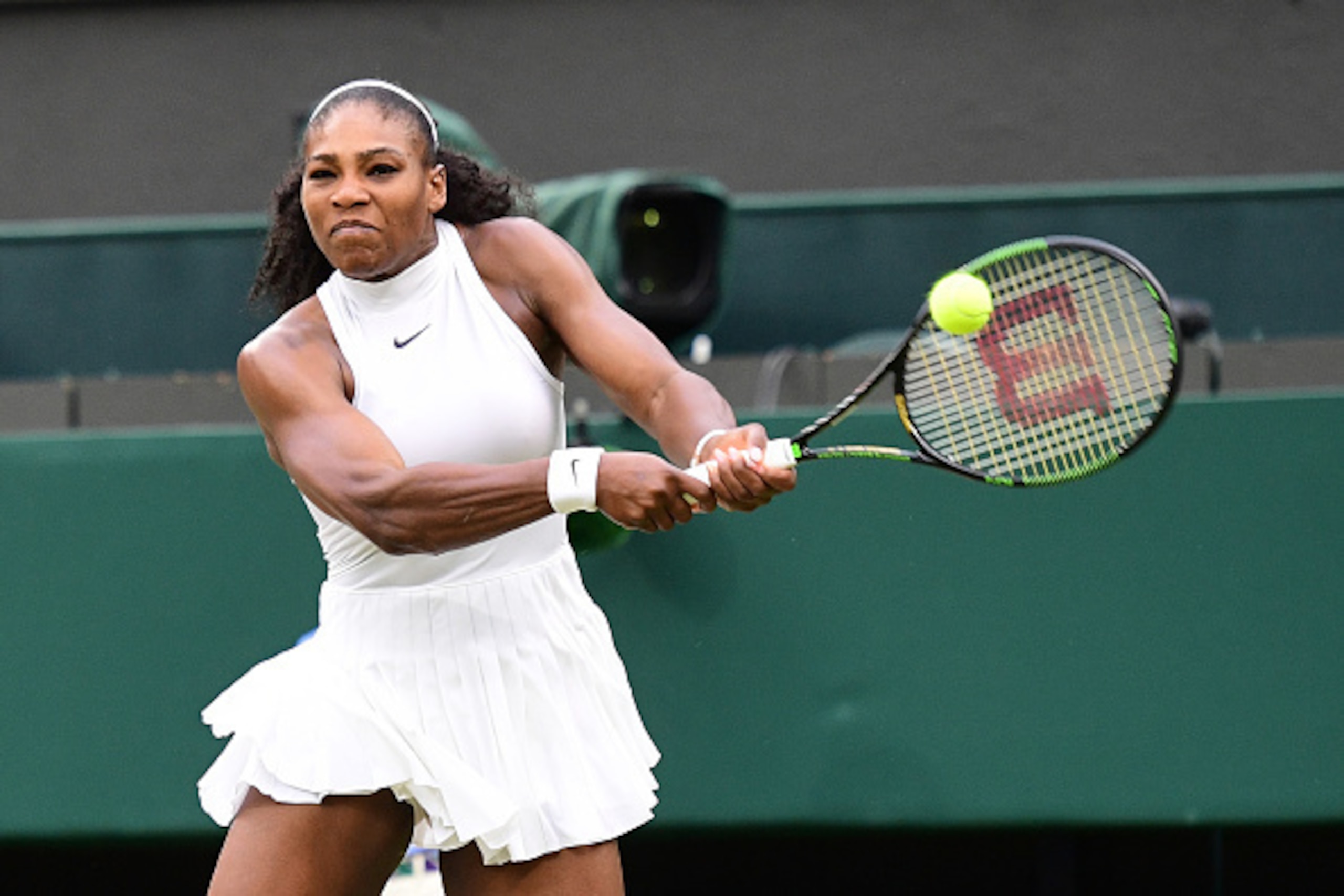 US player Serena Williams returns to Russia's Svetlana Kuznetsova during their women's singles fourth round match on the eighth day of the 2016 Wimbledon Championships at The All England Lawn Tennis Club in Wimbledon, southwest London, on July 4, 2016. / 