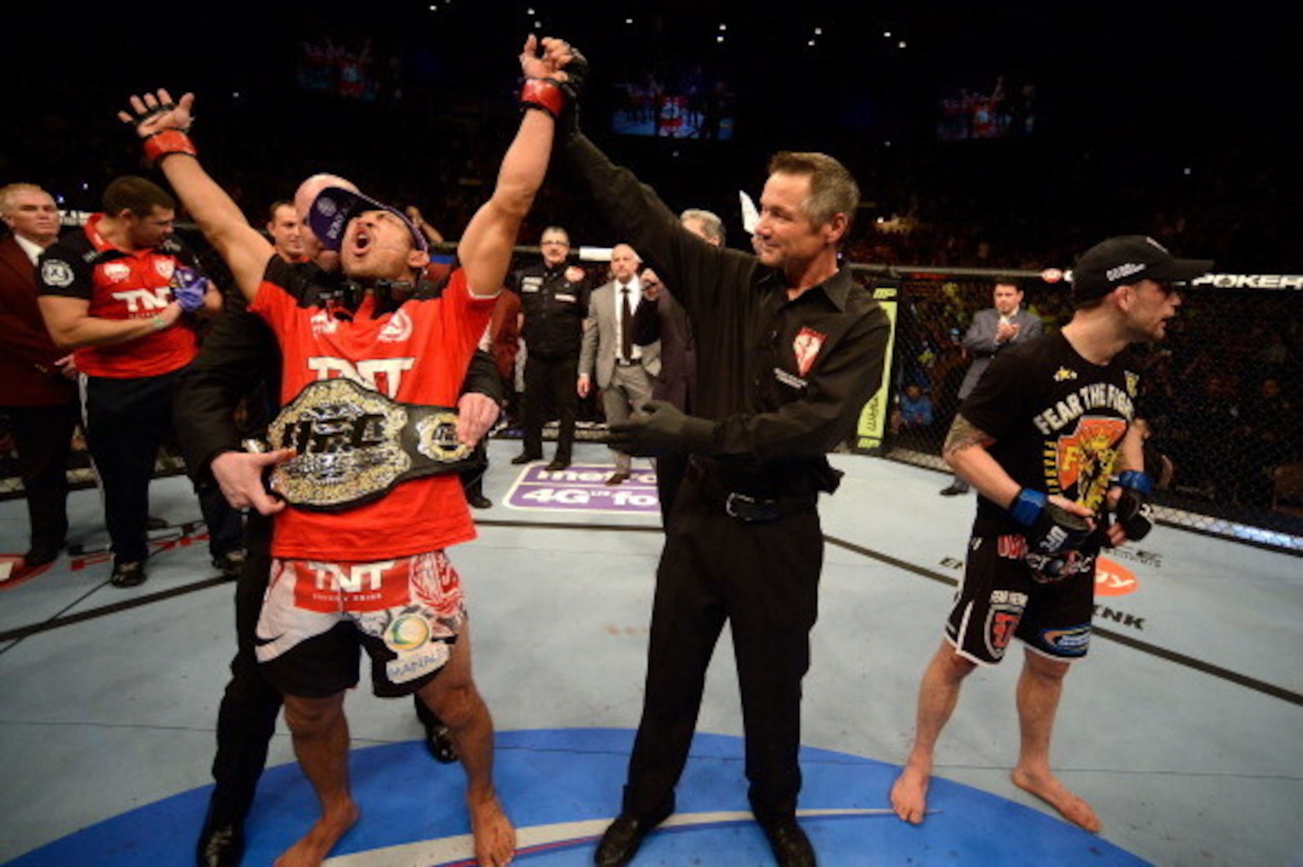 LAS VEGAS, NV - FEBRUARY 02:  Jose Aldo (left) reacts to his victory over Frankie Edgar (right) after their featherweight title fight at UFC 156 on February 2, 2013 at the Mandalay Bay Events Center in Las Vegas, Nevada.  (Photo by Josh Hedges/Zuffa LLC/Z