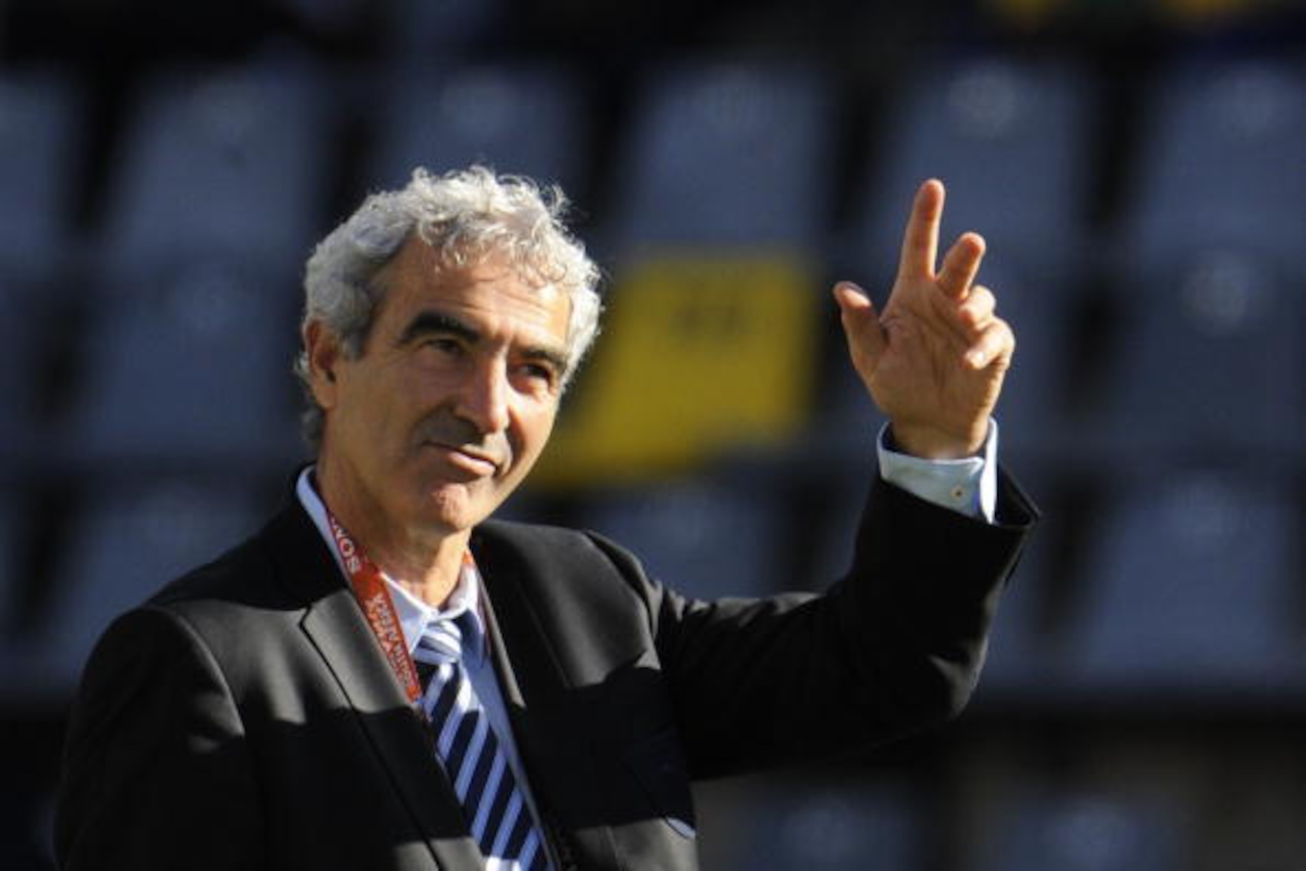 France's coach Raymond Domenech waves as he walks on the pitch prior to the start of the Group A first round 2010 World Cup football match France vs. South Africa on June 22, 2010 at Free State Stadium in Mangaung/Bloemfontein. NO PUSH TO MOBILE / MOBILE 