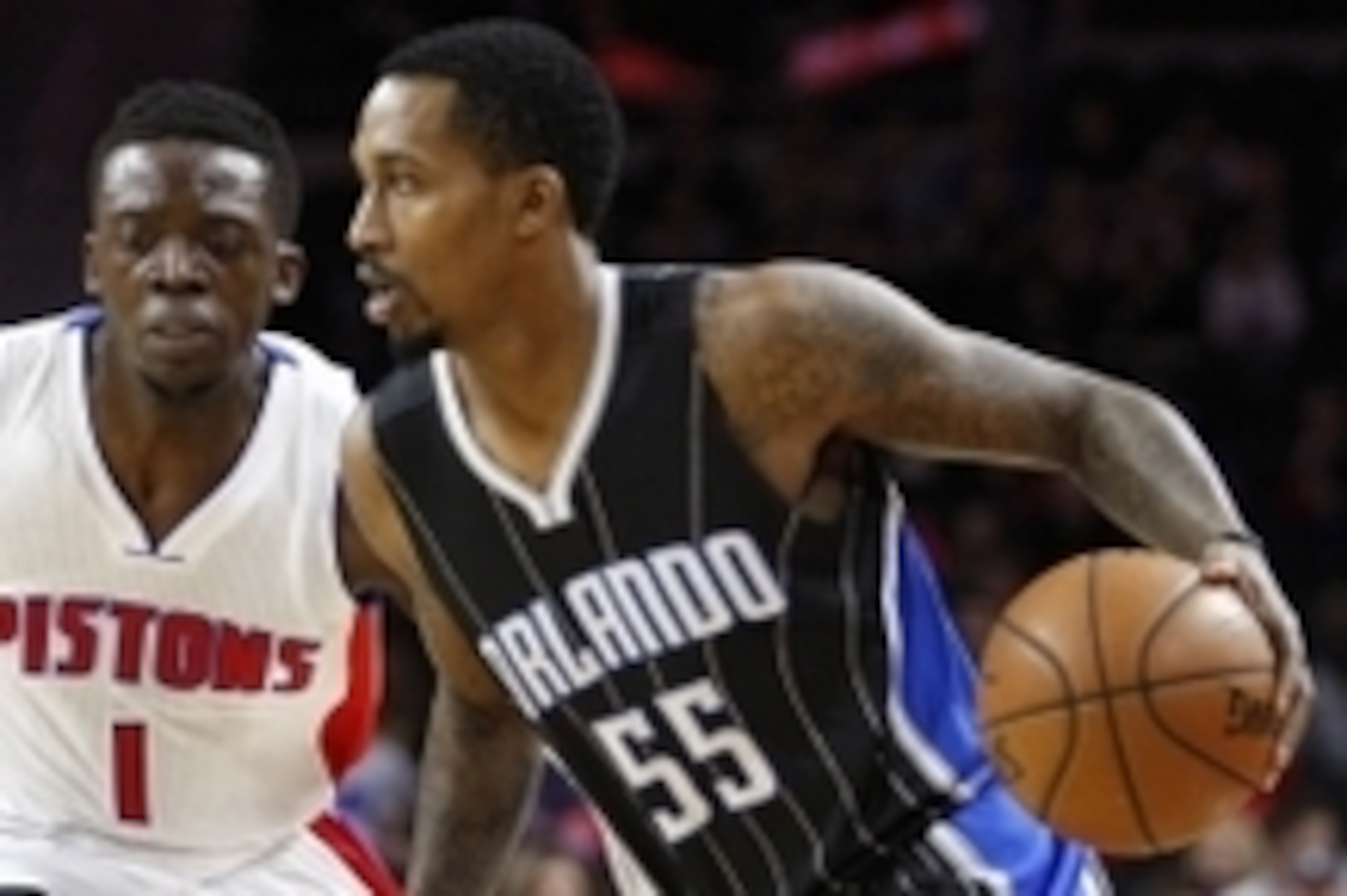 Mar 23, 2016; Auburn Hills, MI, USA; Orlando Magic guard Brandon Jennings (55) dribbles the ball as Detroit Pistons guard Reggie Jackson (1) defends during the first quarter at The Palace of Auburn Hills. Mandatory Credit: Raj Mehta-USA TODAY Sports
