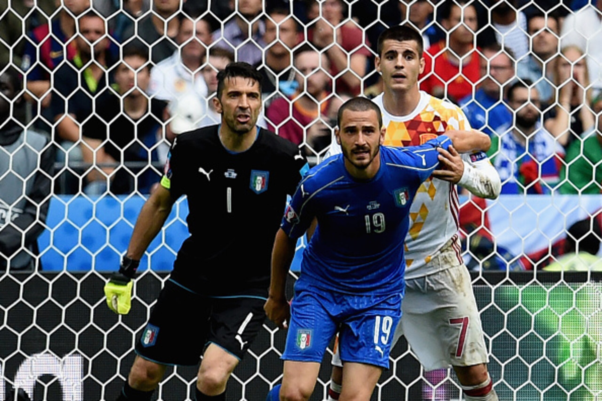 PARIS, FRANCE - JUNE 27:  (L-R) Gianluigi Buffon, Leonardo Bonucci and Alvaro Morata of Spain compete for the ball during the UEFA Euro 2016 Round of 16 match between Italy and Spain at Stade de France on June 27, 2016 in Paris, France.  (Photo by Claudio