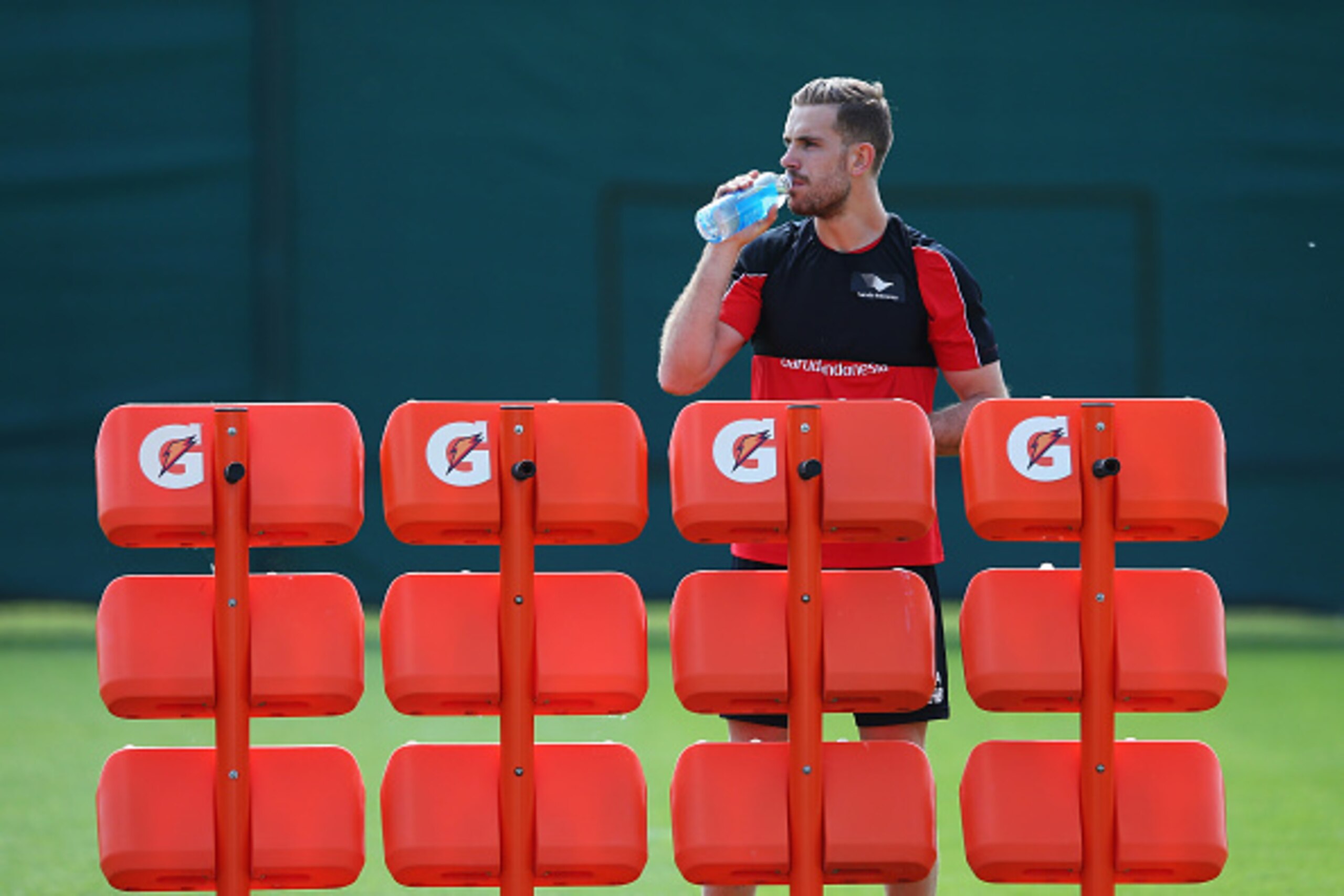 LIVERPOOL, ENGLAND - MAY 13: Jordan Henderson of Liverpool drinks during a training session at the Liverpool UEFA Europa League Cup Final Media Day at Melwood Training Ground on May 13, 2016 in Liverpool, England.  (Photo by Alex Livesey/Getty Images)